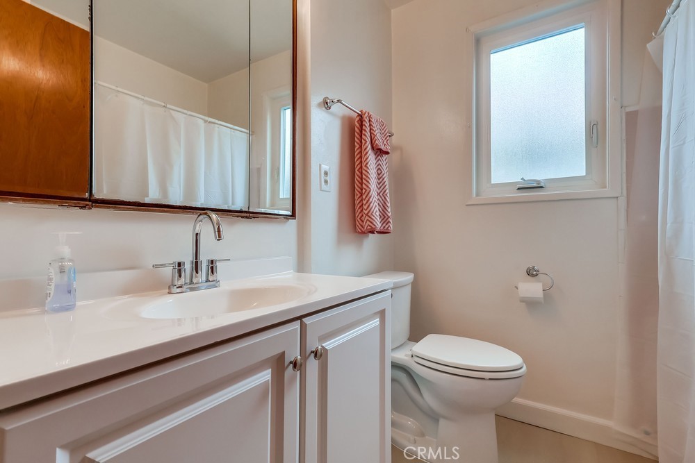 11639 Harvard Drive Norwalk, CA 90650 - Photo 27 of 33 a bathroom with a sink a toilet and mirror
