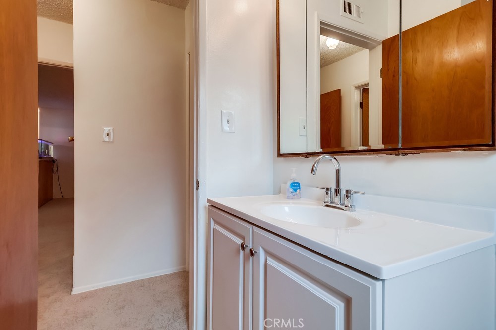 11639 Harvard Drive Norwalk, CA 90650 - Photo 28 of 33 a bathroom with a sink and a mirror