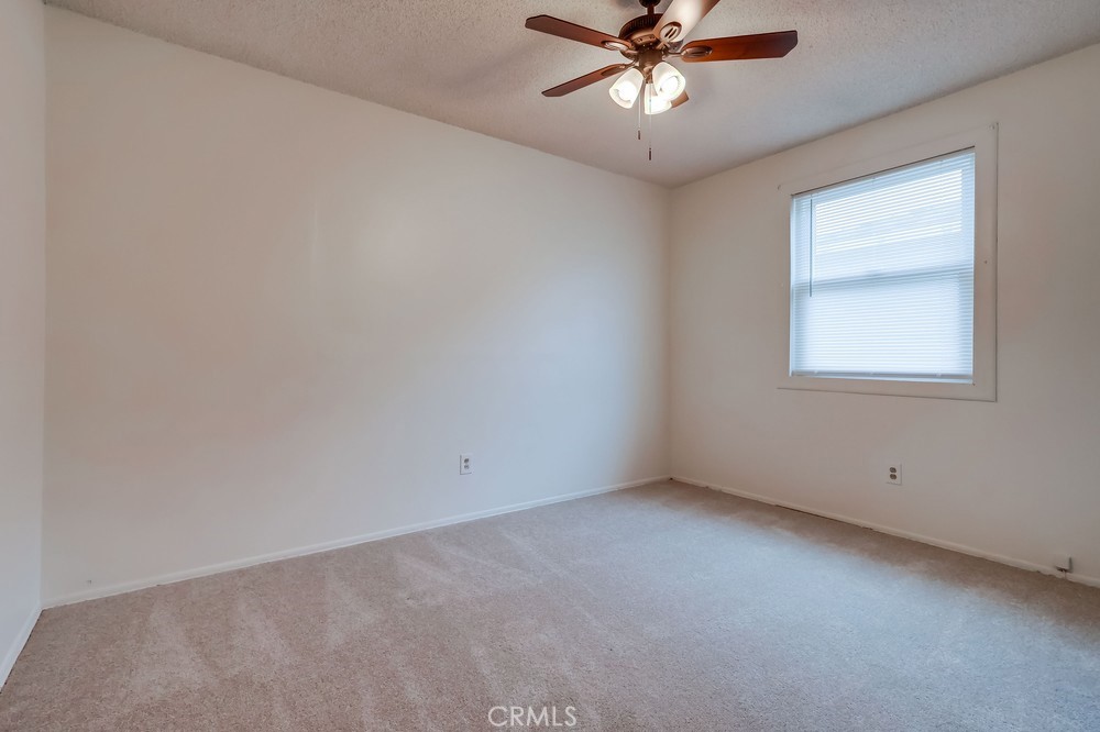 11639 Harvard Drive Norwalk, CA 90650 - Photo 29 of 33 an empty room with a window and a fan