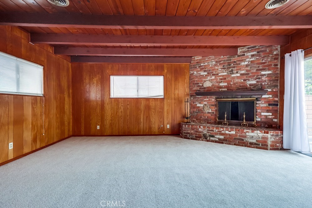 11639 Harvard Drive Norwalk, CA 90650 - Photo 6 of 33 a view of an empty room with a fireplace