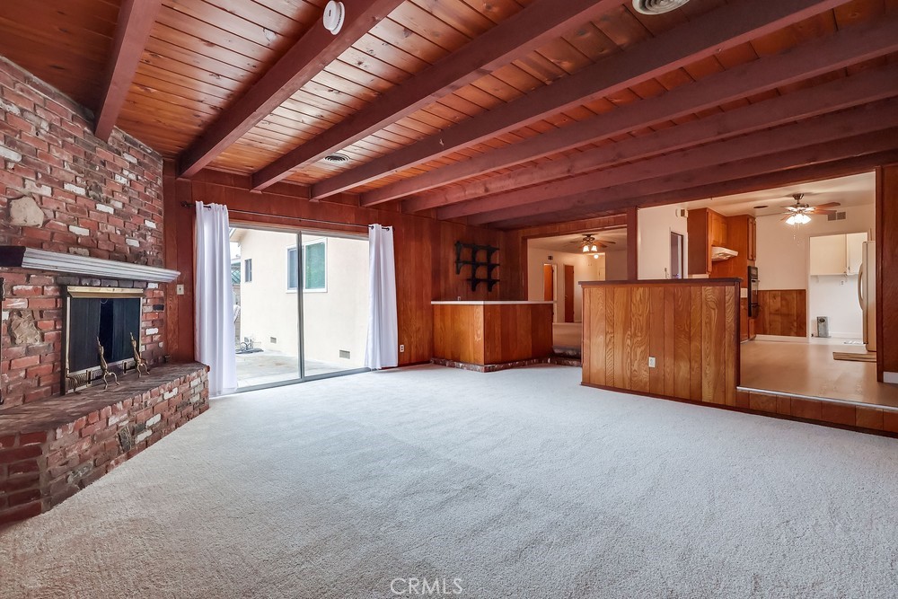 11639 Harvard Drive Norwalk, CA 90650 - Photo 8 of 33 a view of an empty room with fireplace and a window