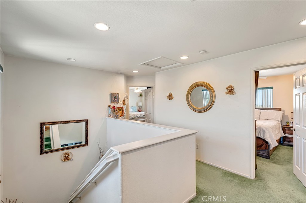 11036 Windcrest Court Adelanto, CA 92301 - Photo 24 of 45 a view of a room that has a bed and a chandelier