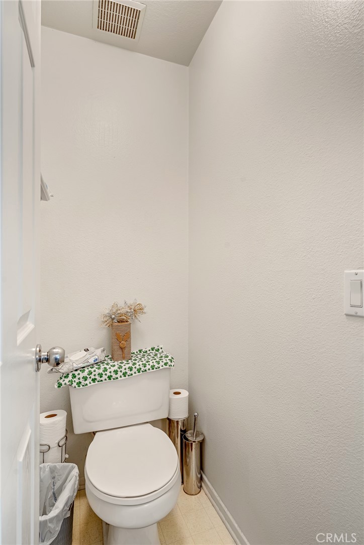 11036 Windcrest Court Adelanto, CA 92301 - Photo 29 of 45 a white toilet sitting next to a bathroom sink