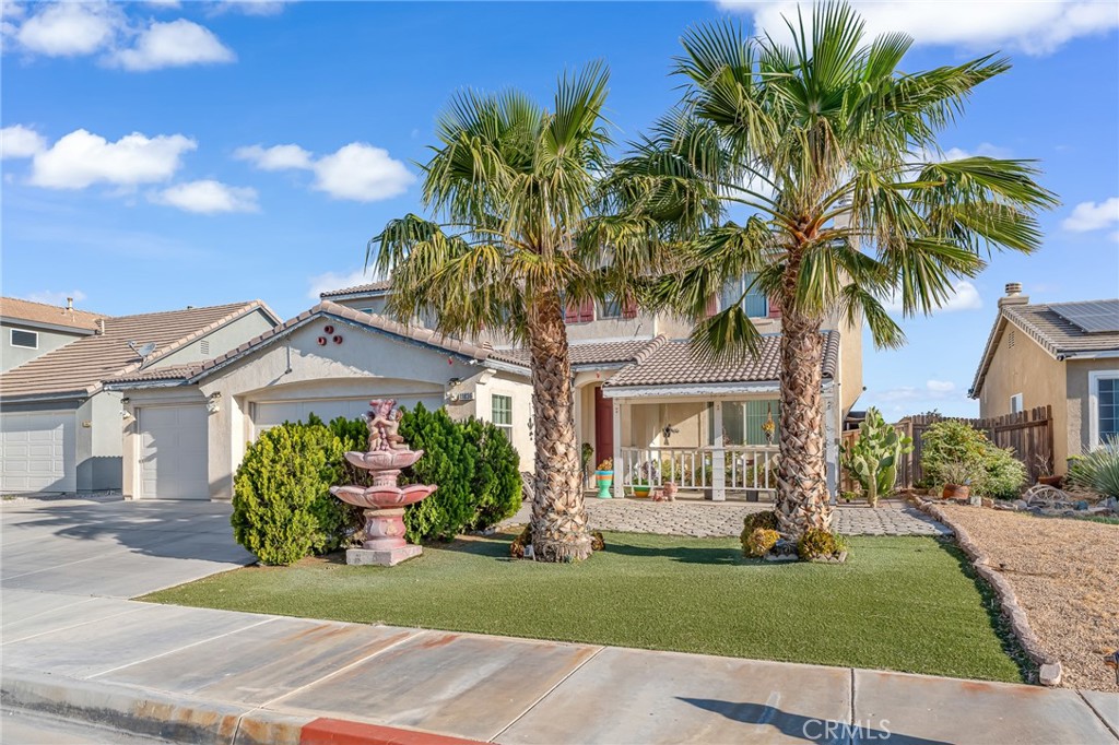 11036 Windcrest Court Adelanto, CA 92301 - Photo 38 of 45 a front view of a house with a garden