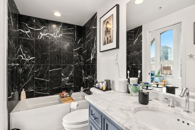 a living room with patio furniture and a flat screen tv