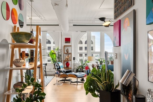 a kitchen with a sink a stove and cabinets