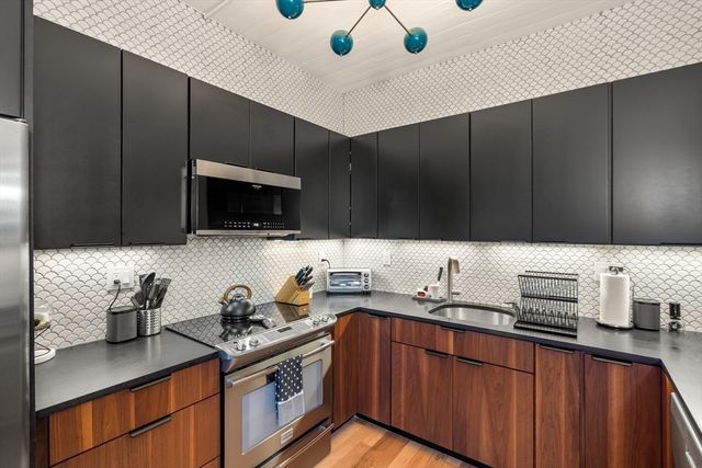 a bedroom with double bed and a window