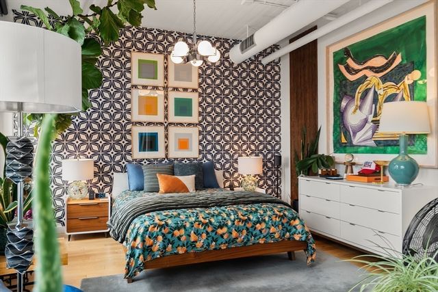 a bedroom with bed and a couch