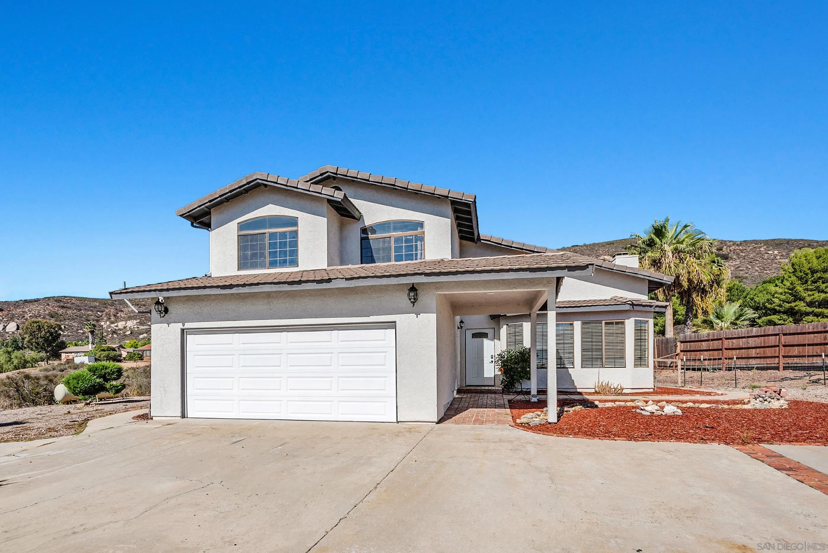 24252 Sargeant Road Ramona, CA 92065 - Photo 1 of 57 front view of a house with a porch