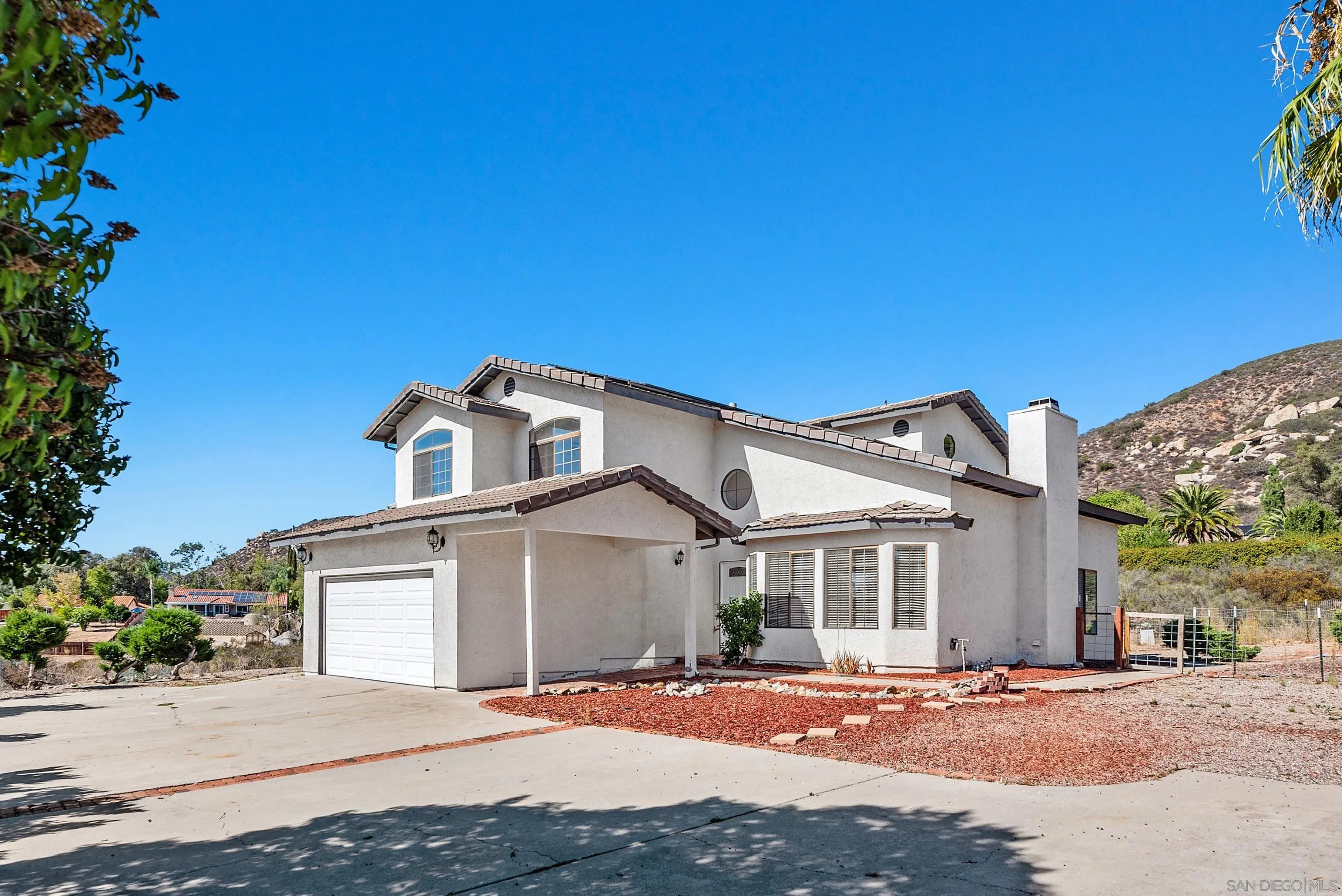 24252 Sargeant Road Ramona, CA 92065 - Photo 11 of 57 a front view of a house with a yard
