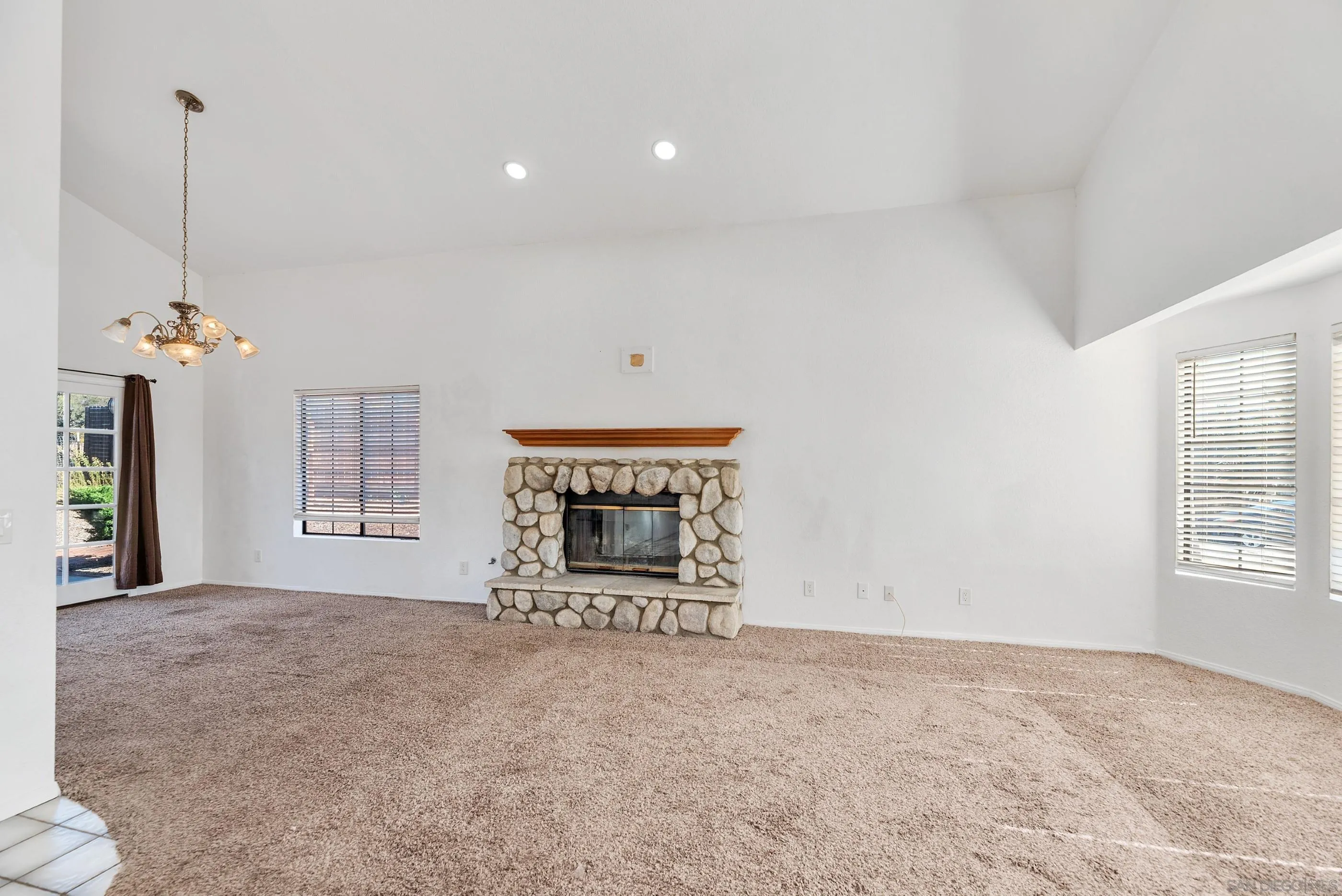 24252 Sargeant Road Ramona, CA 92065 - Photo 17 of 57 a view of an empty room with a window