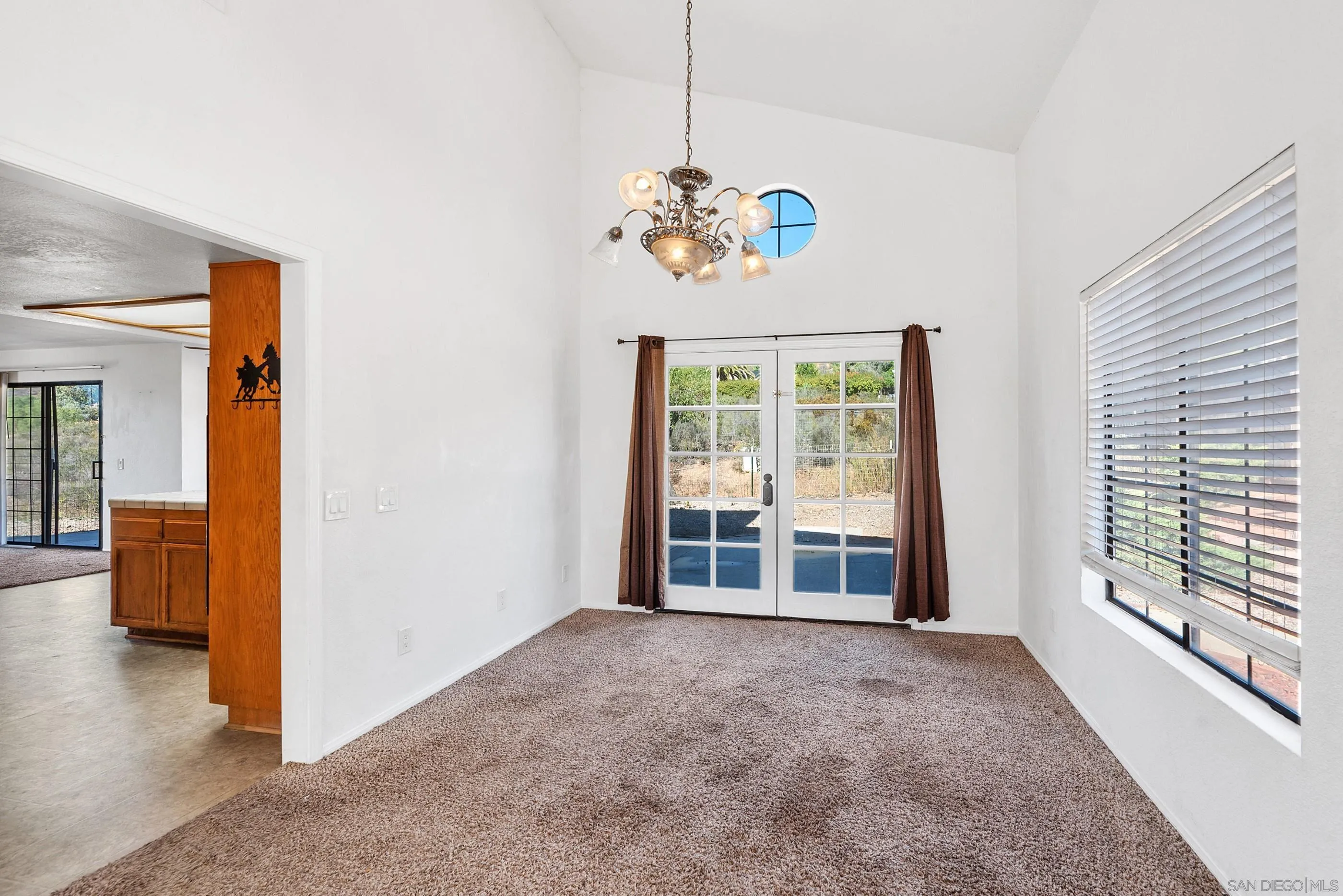 24252 Sargeant Road Ramona, CA 92065 - Photo 19 of 57 a view of an empty room with a window