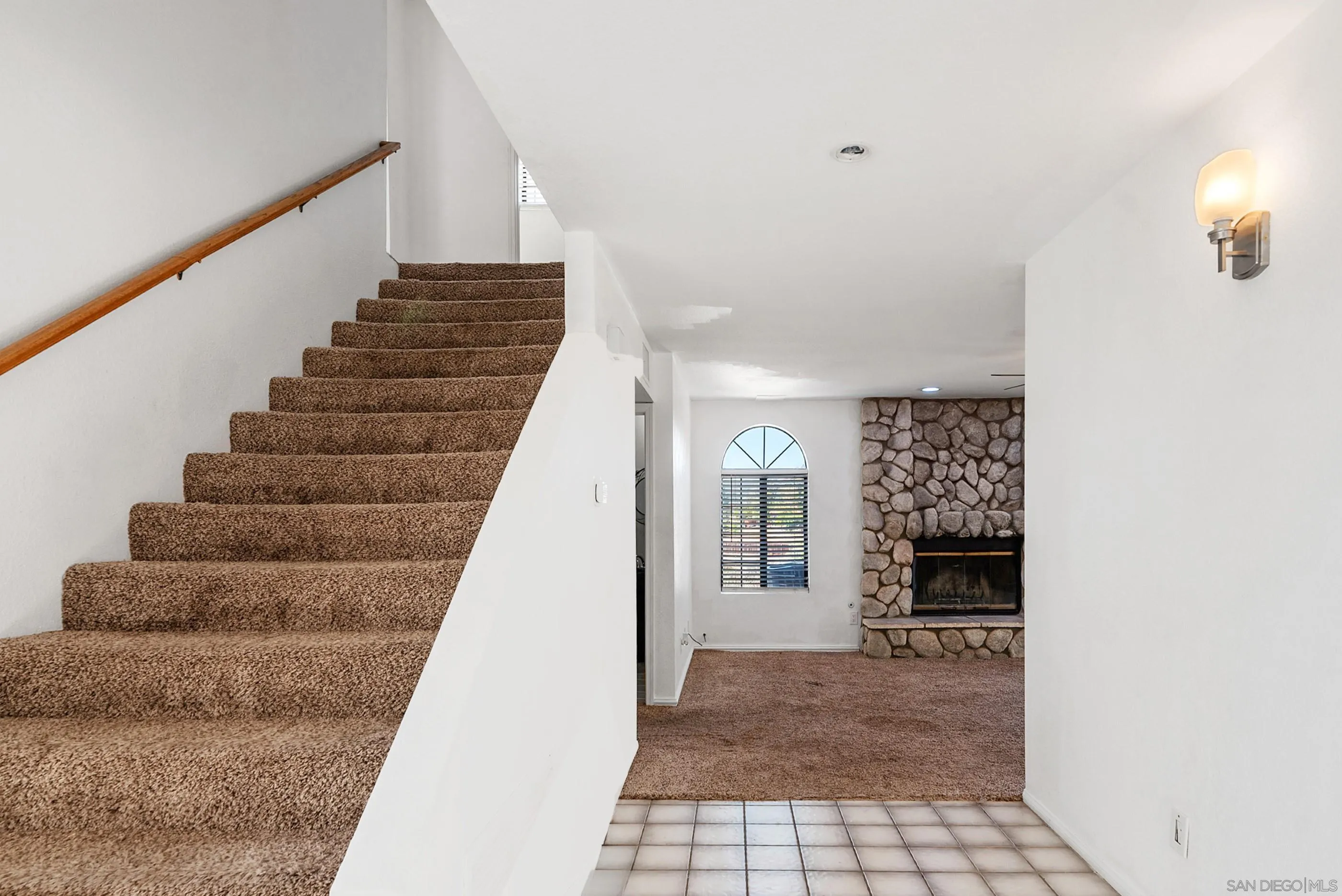 24252 Sargeant Road Ramona, CA 92065 - Photo 32 of 57 a view of entryway and hall with wooden floor