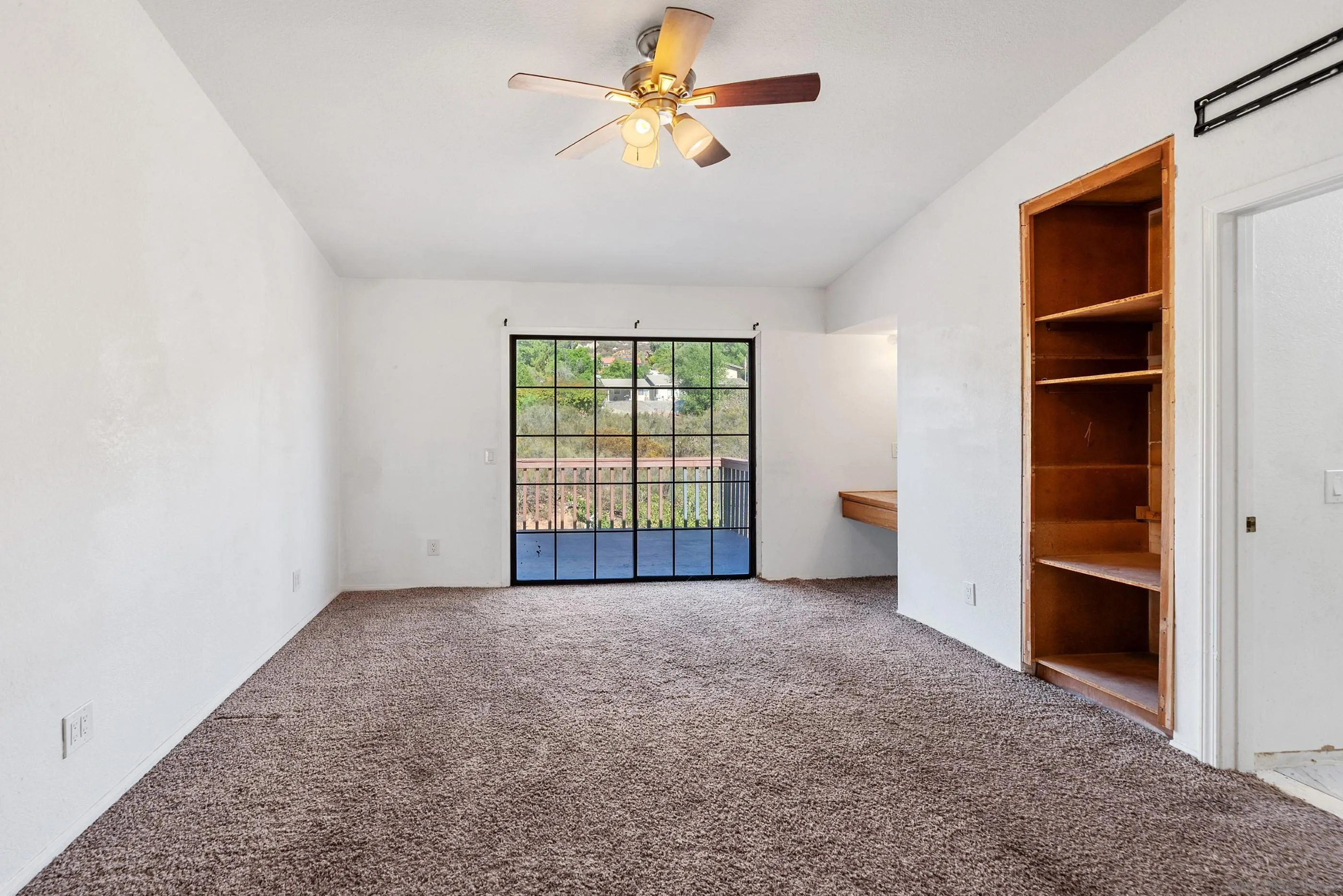 24252 Sargeant Road Ramona, CA 92065 - Photo 33 of 57 an empty room with windows and fan
