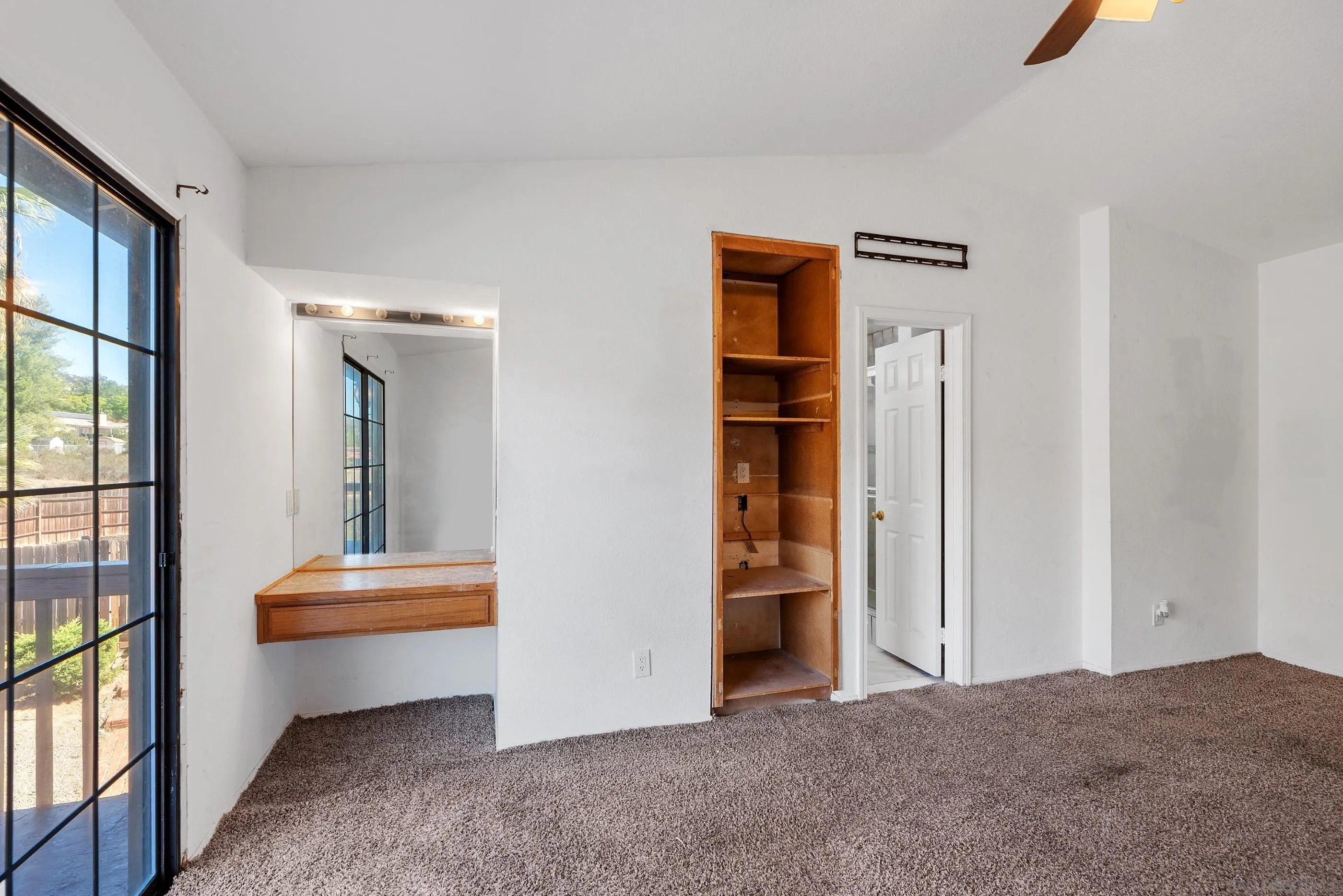24252 Sargeant Road Ramona, CA 92065 - Photo 35 of 57 a view of room with wooden floor and cabinet