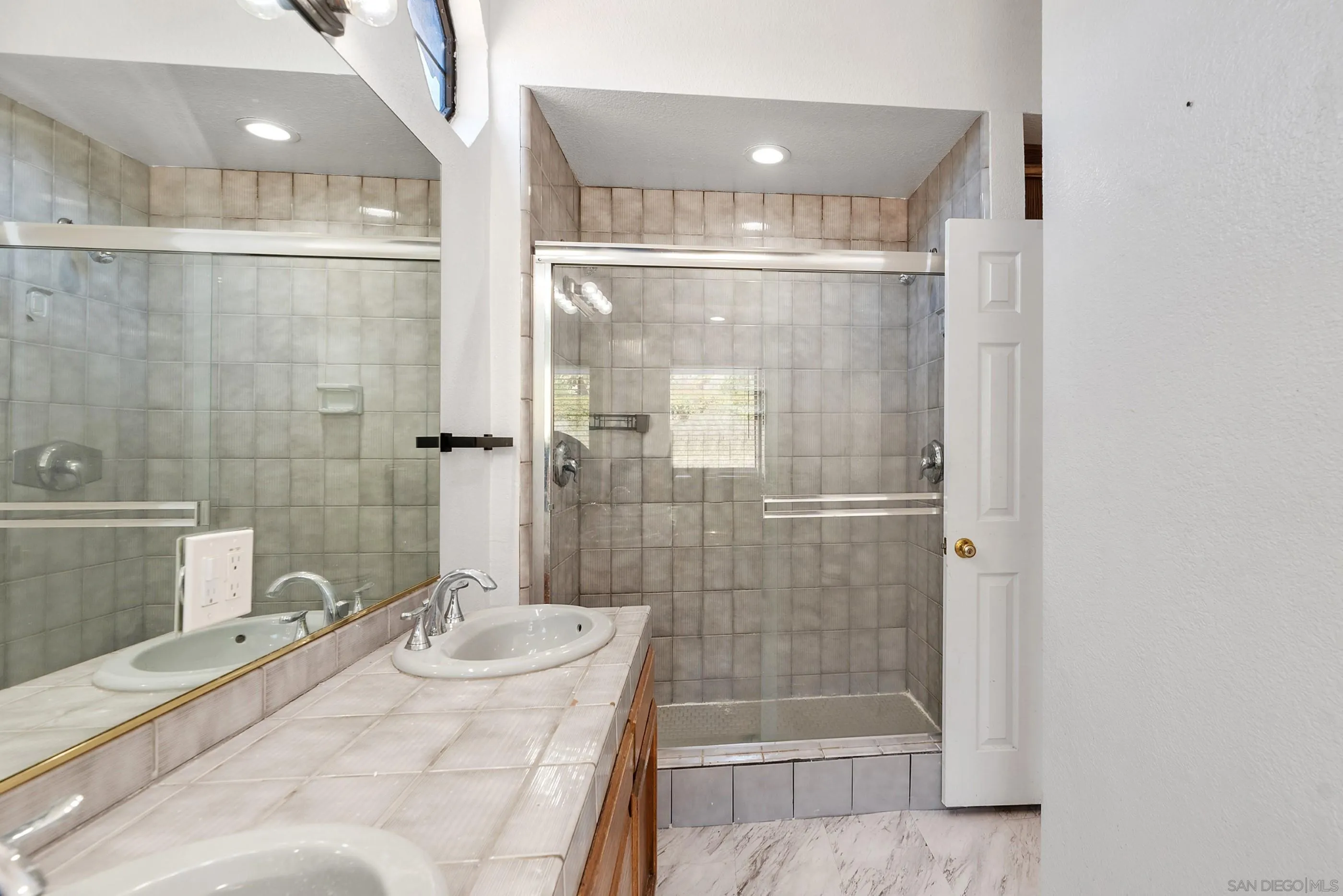 24252 Sargeant Road Ramona, CA 92065 - Photo 37 of 57 a bathroom with a shower and a sink