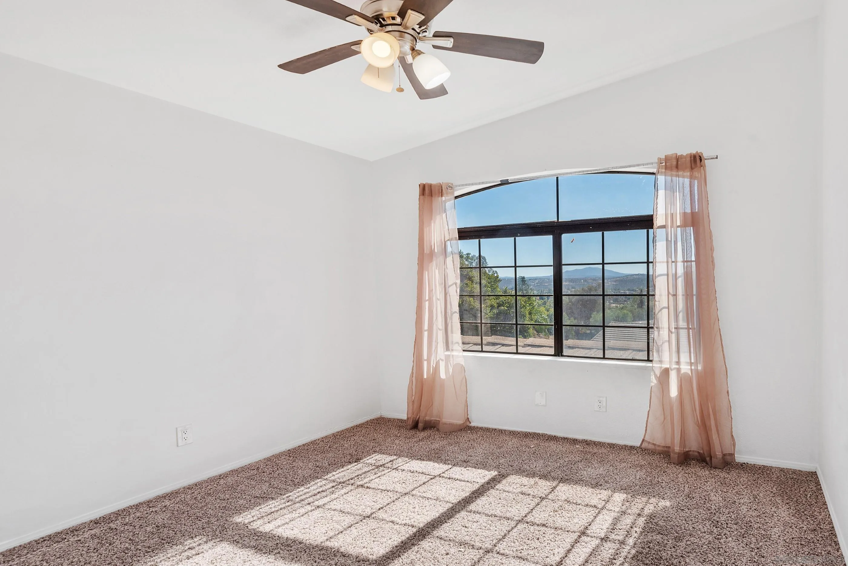24252 Sargeant Road Ramona, CA 92065 - Photo 41 of 57 a view of an empty room with a window