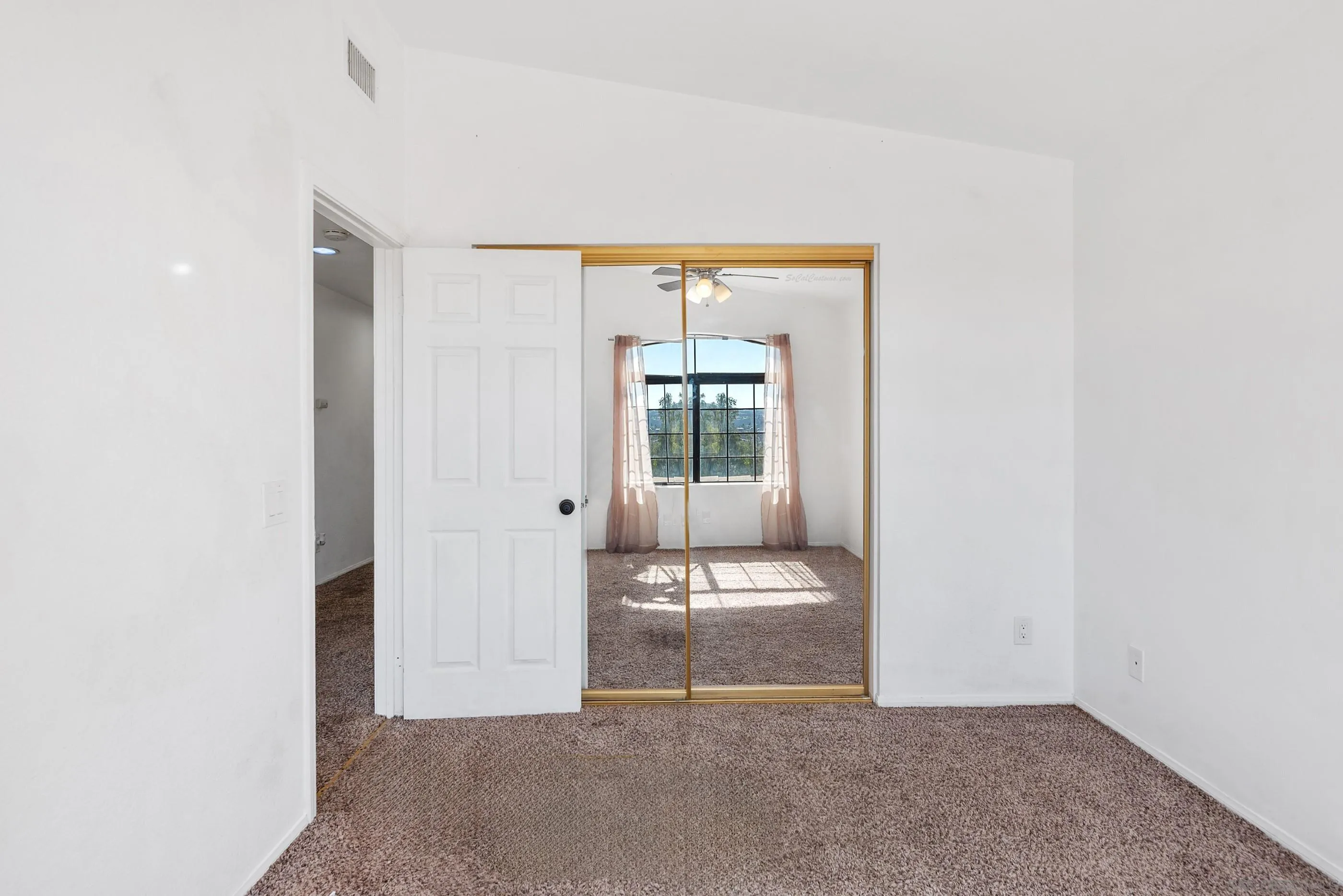 24252 Sargeant Road Ramona, CA 92065 - Photo 42 of 57 a view of a room that has a bed and a window