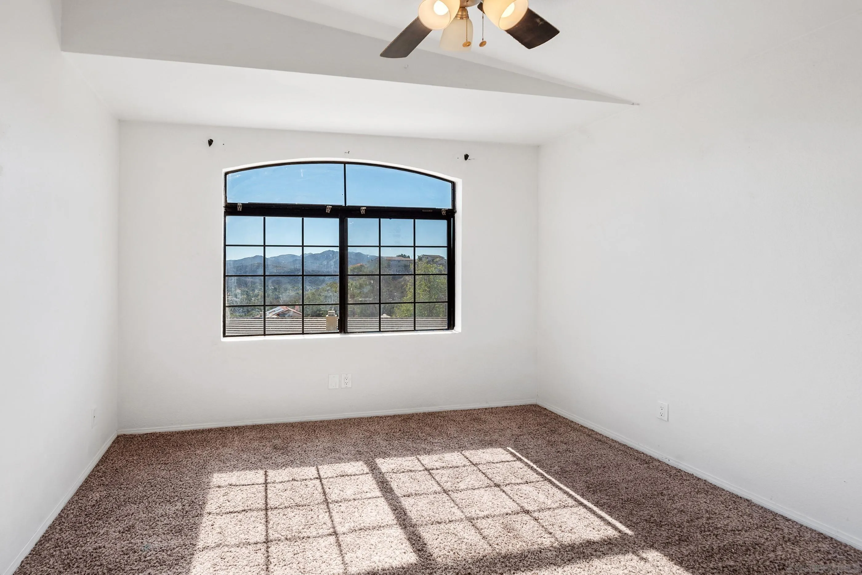 24252 Sargeant Road Ramona, CA 92065 - Photo 43 of 57 an empty room with windows