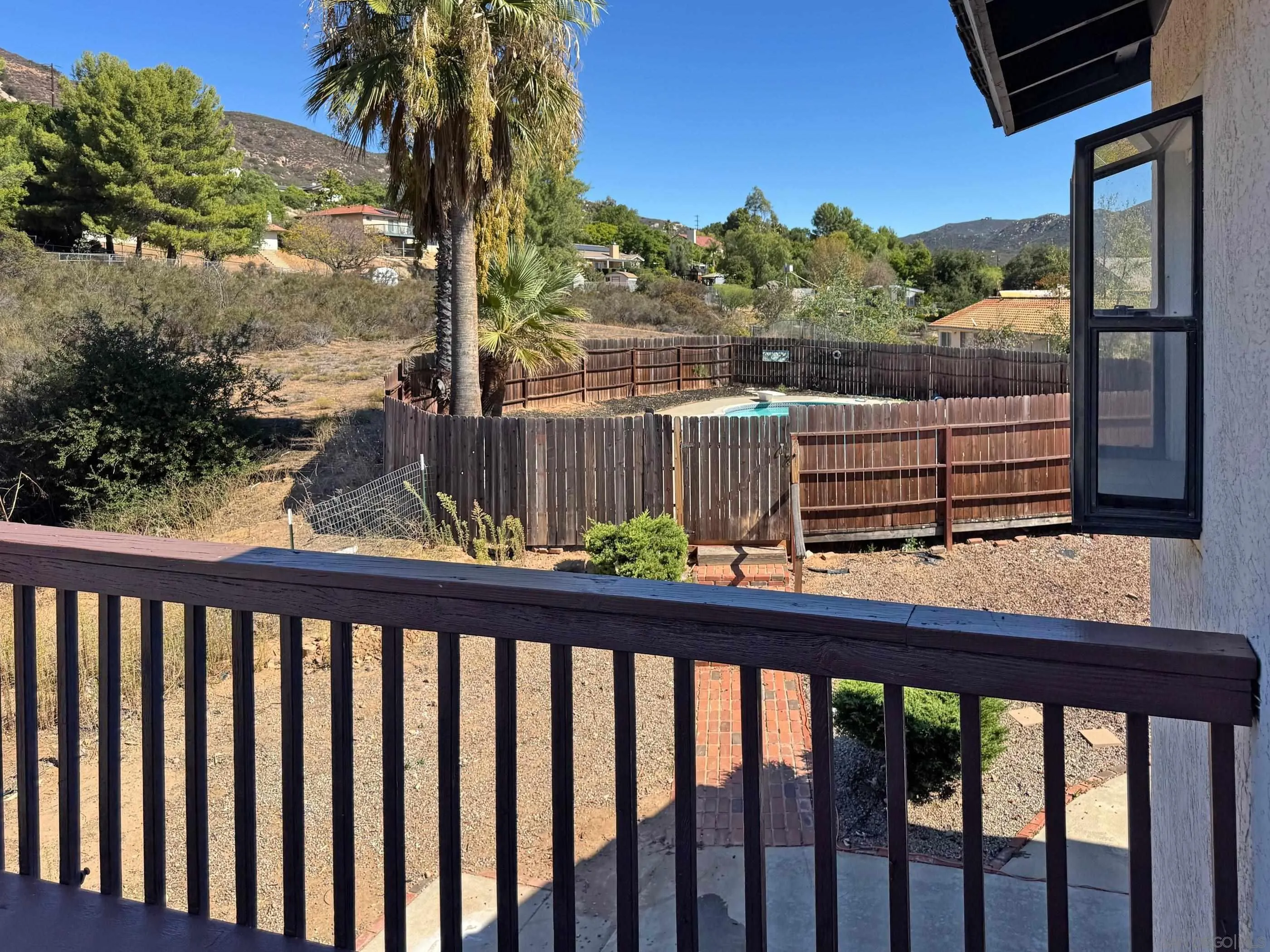 24252 Sargeant Road Ramona, CA 92065 - Photo 53 of 57 a view of a balcony with a lake view