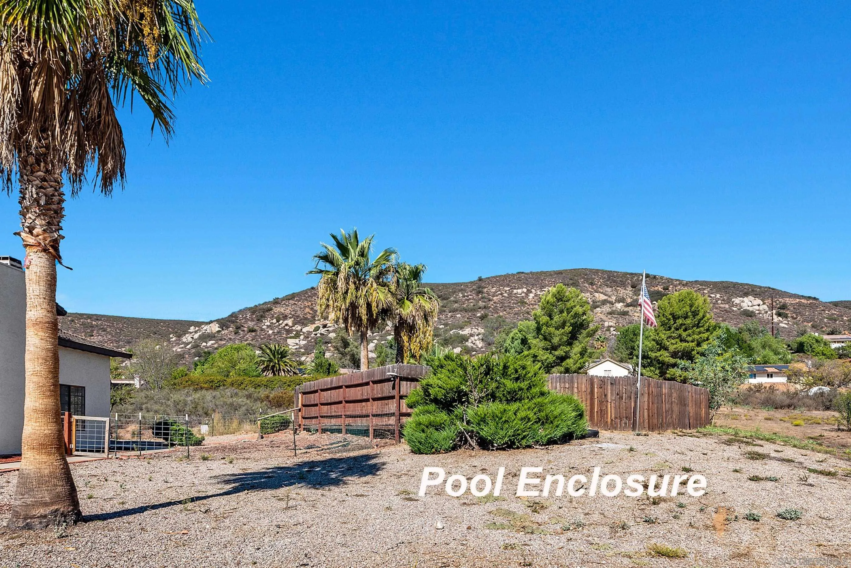 24252 Sargeant Road Ramona, CA 92065 - Photo 8 of 57 a view of a backyard with a garden and plants