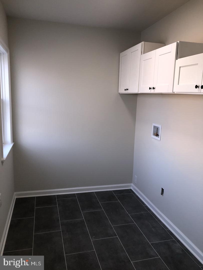 504 Bridge Street Beverly, NJ 08010 - Photo 10 of 13 a view of a utility room with a sink