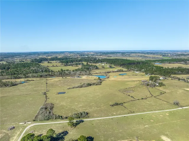 a view of a lake with a yard