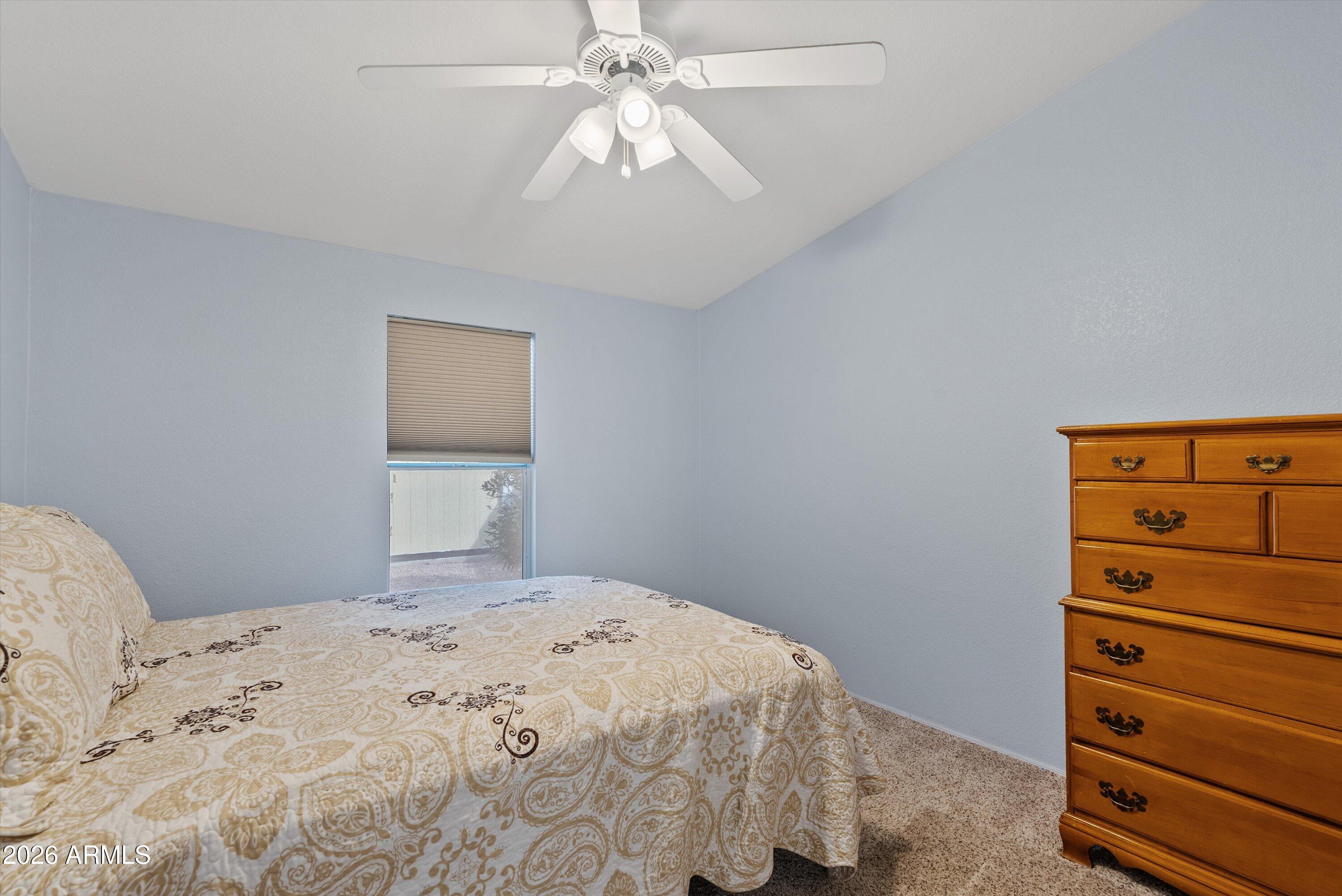3700 South Tomahawk Road, Unit 91 Apache Junction, AZ 85119 - Photo 17 of 29 a bedroom with a bed and a dresser