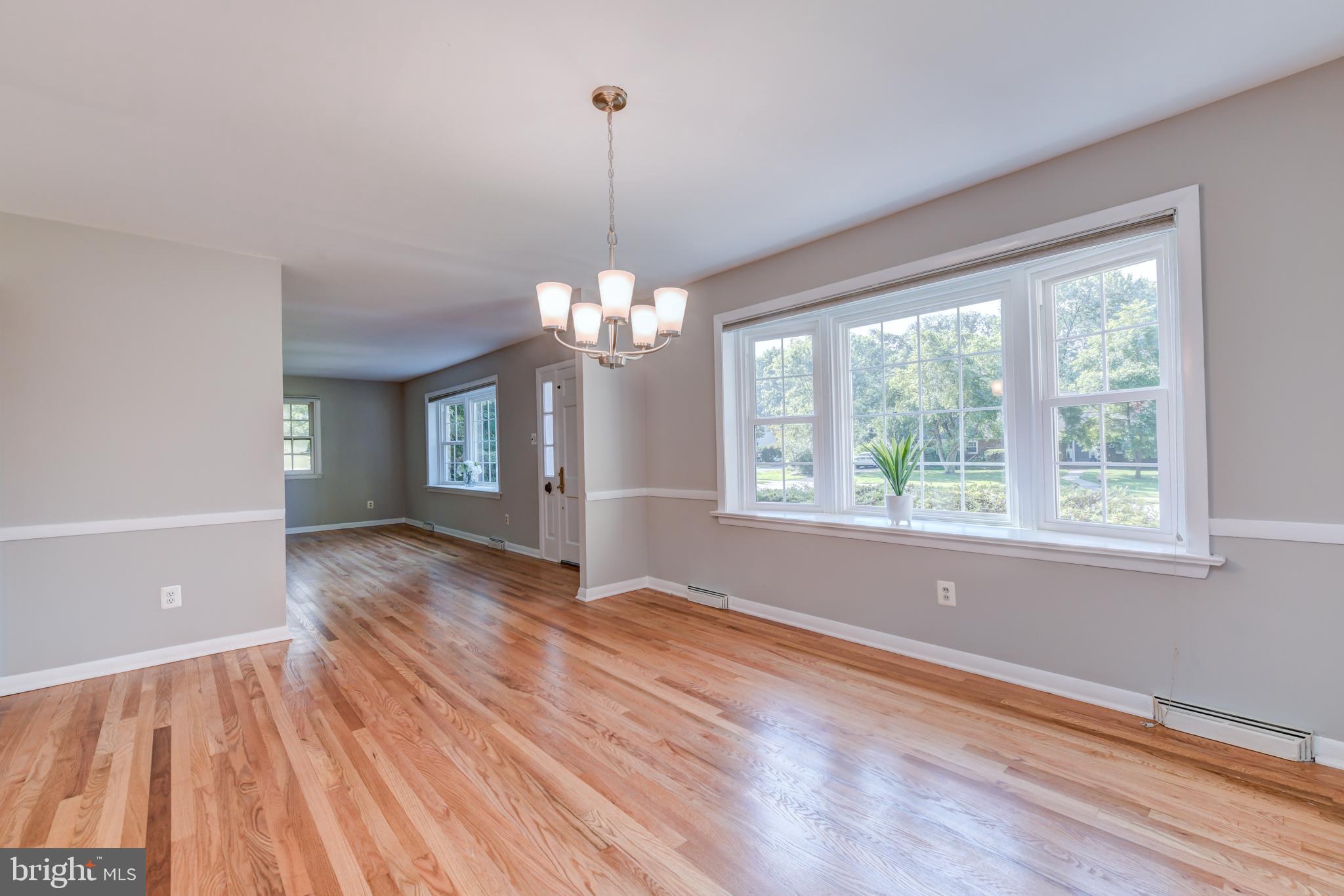 1165 Beverly Road Jenkintown, PA 19046 - Photo 11 of 31 a view of an empty room with wooden floor and a window