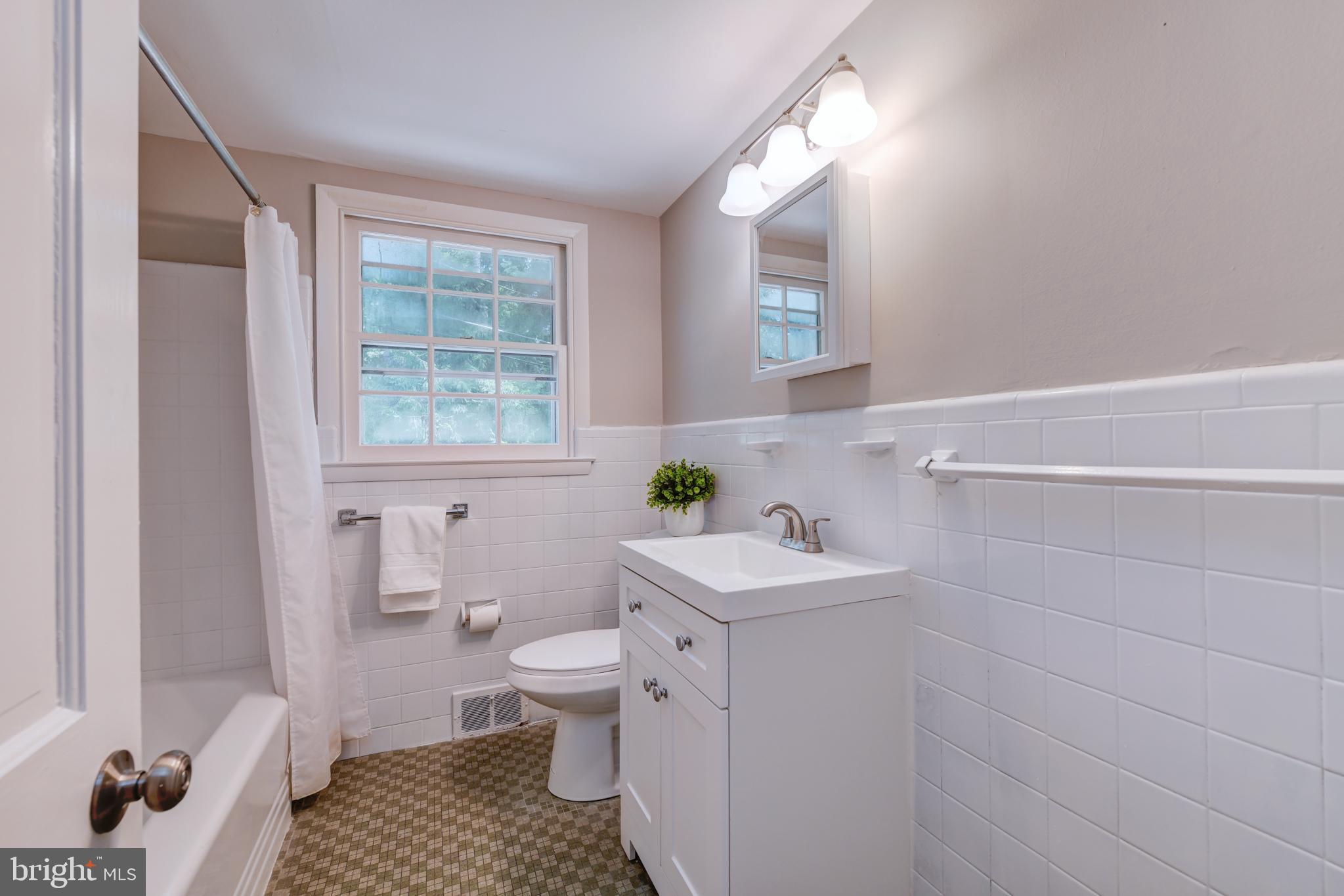 1165 Beverly Road Jenkintown, PA 19046 - Photo 15 of 31 a bathroom with a sink toilet and window