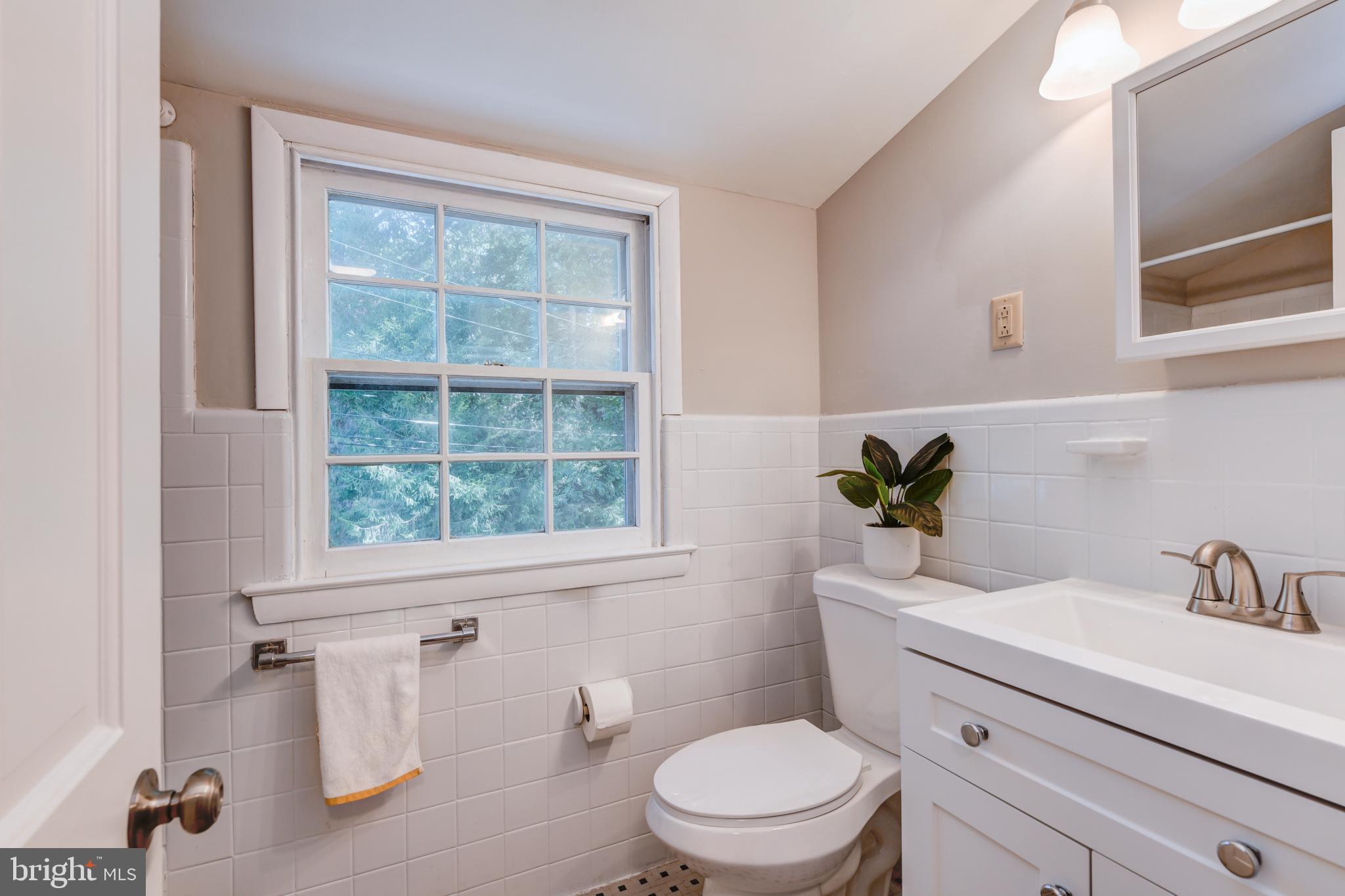 1165 Beverly Road Jenkintown, PA 19046 - Photo 26 of 31 a bathroom with a sink a toilet and a window