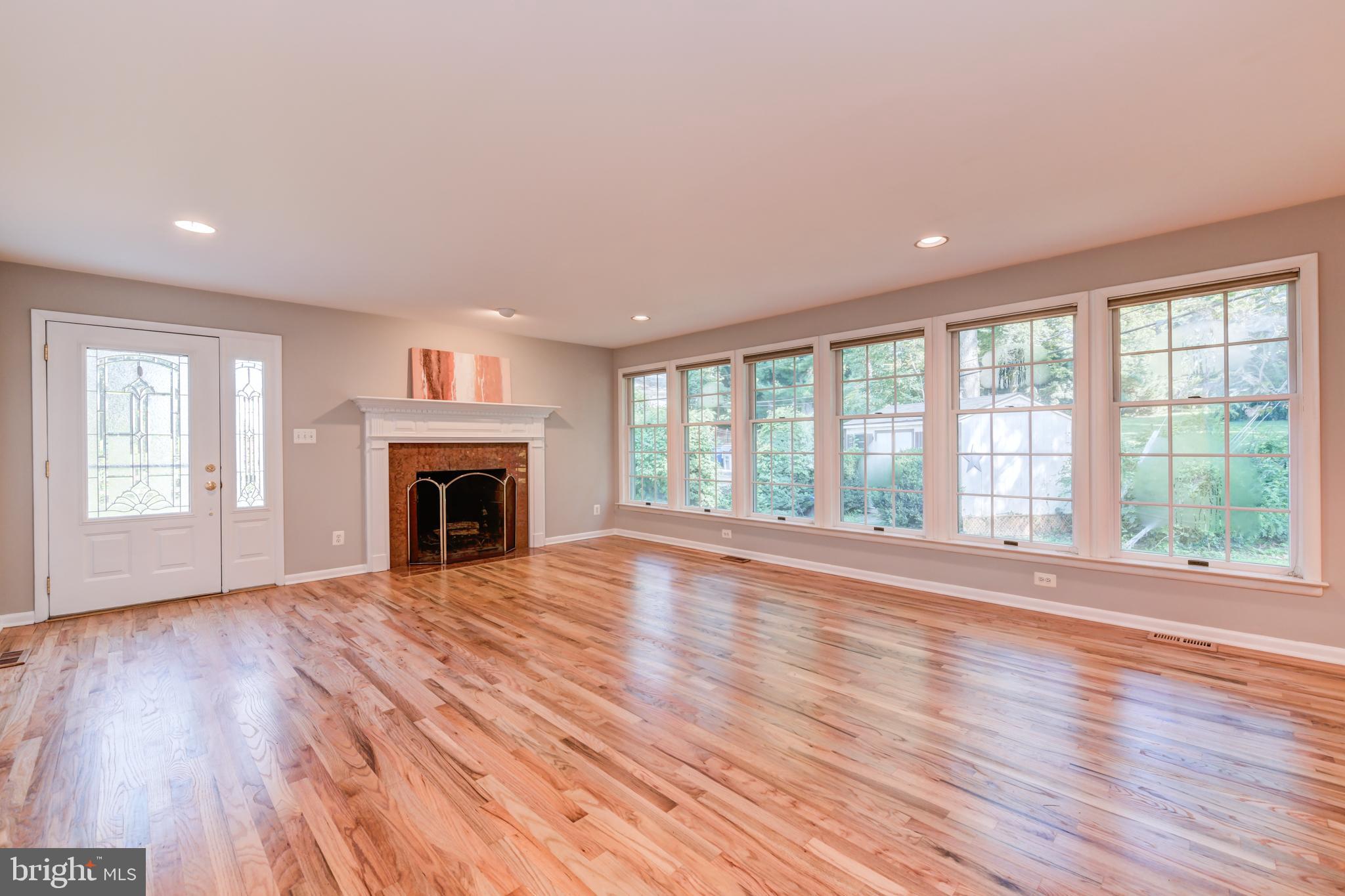 1165 Beverly Road Jenkintown, PA 19046 - Photo 4 of 31 a view of empty room with wooden floor and fireplace