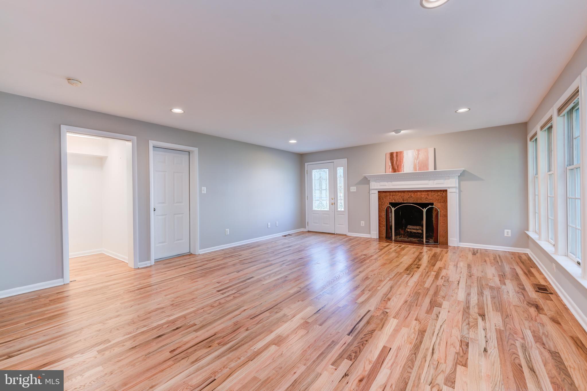 1165 Beverly Road Jenkintown, PA 19046 - Photo 5 of 31 a view of empty room with wooden floor and fireplace