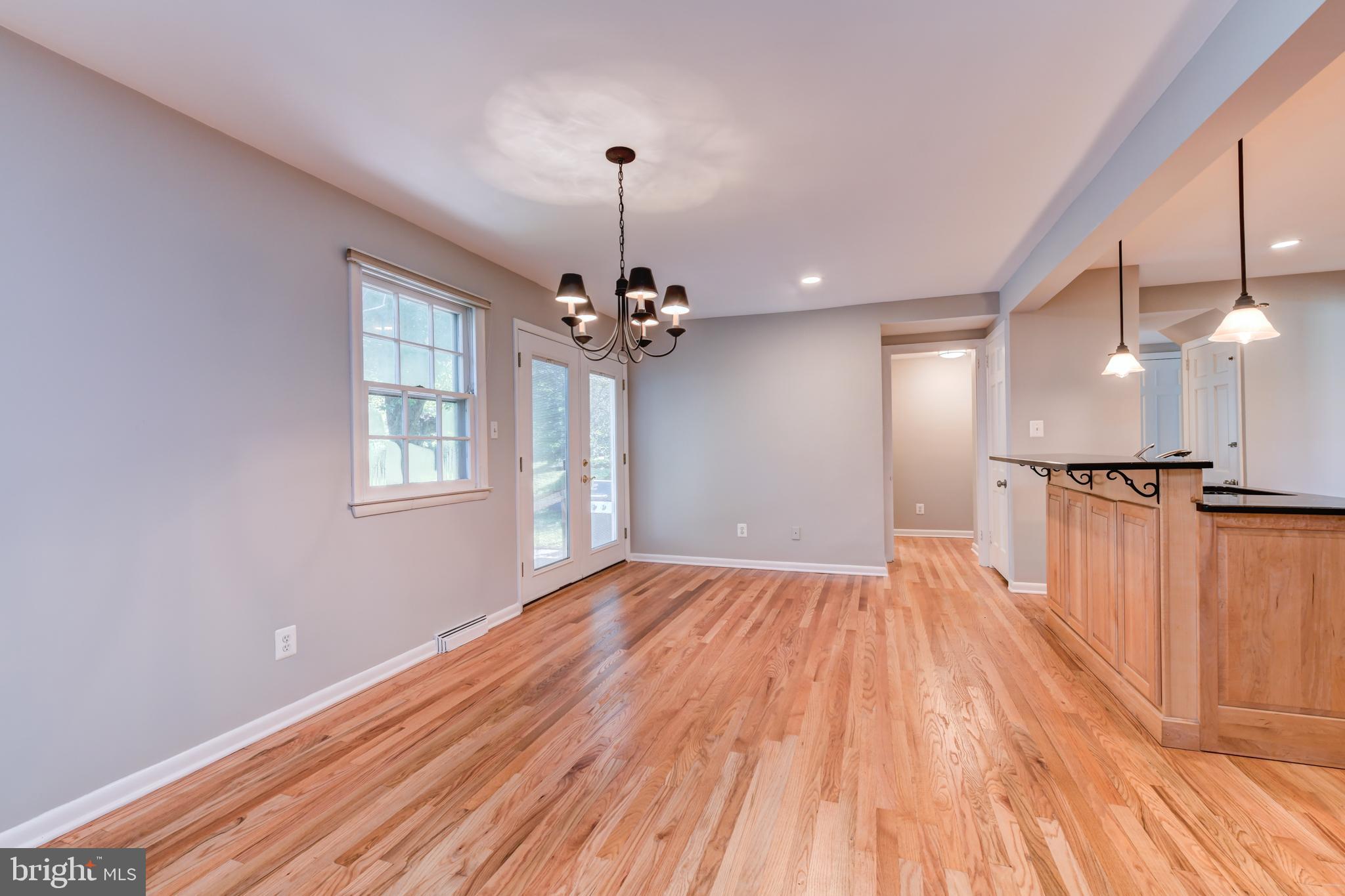 1165 Beverly Road Jenkintown, PA 19046 - Photo 6 of 31 a view of a room with wooden floor chandelier and windows