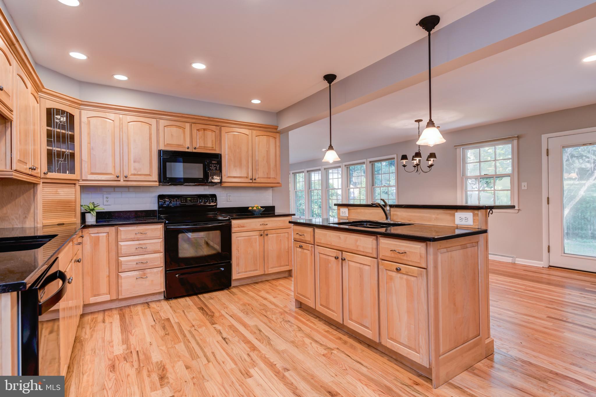 1165 Beverly Road Jenkintown, PA 19046 - Photo 8 of 31 a kitchen with stainless steel appliances granite countertop a sink a stove and a wooden floors