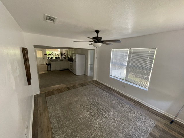 4611 Glissman Road Austin, TX 78702 - Photo 2 of 11 An inviting dining area offers a seamless flow into a bright, well-appointed kitchen.