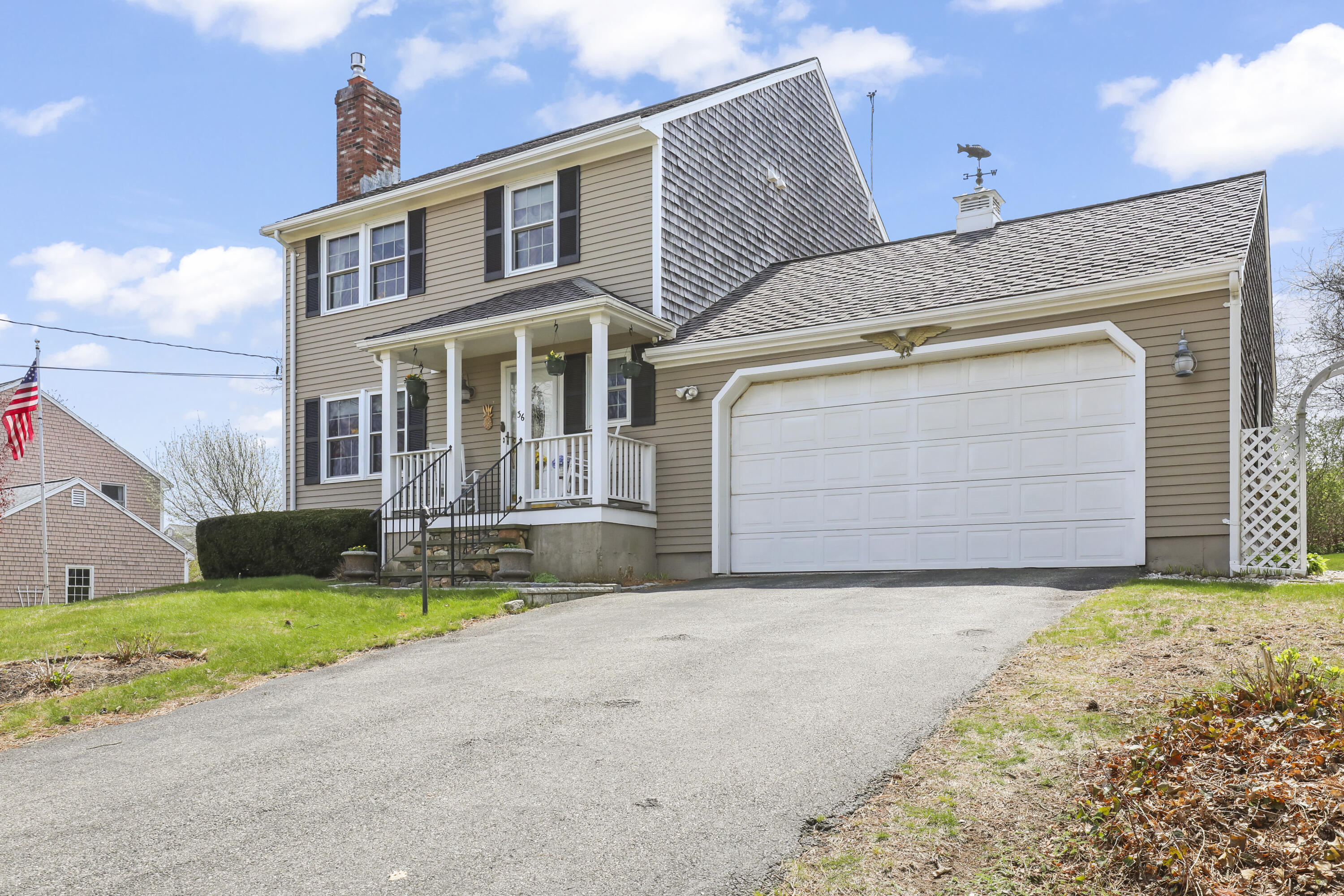 36 Town Neck Road Sandwich, MA 02563 - Photo 2 of 67 a front view of a house with a yard and garage