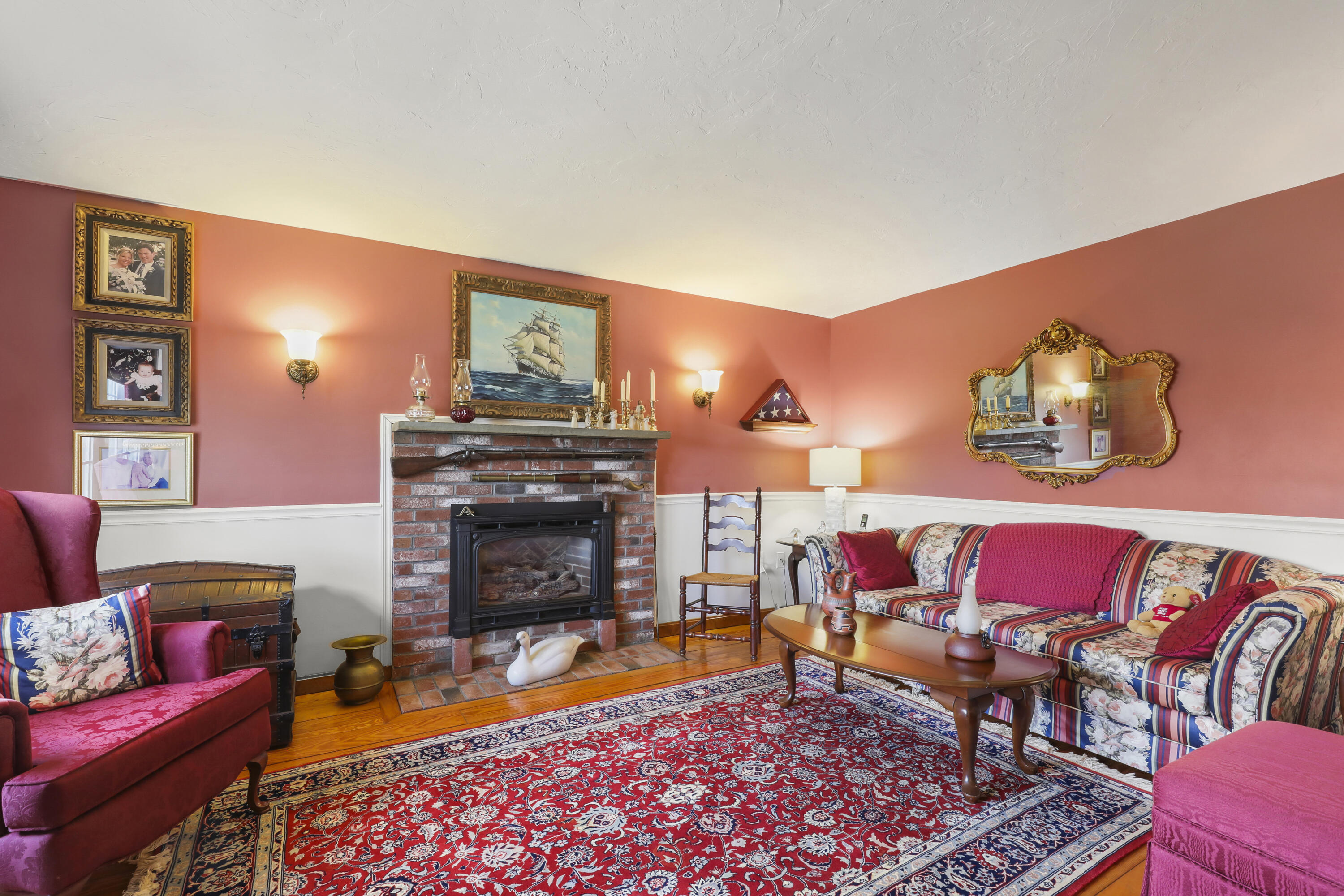 36 Town Neck Road Sandwich, MA 02563 - Photo 21 of 67 a living room with furniture and a fireplace