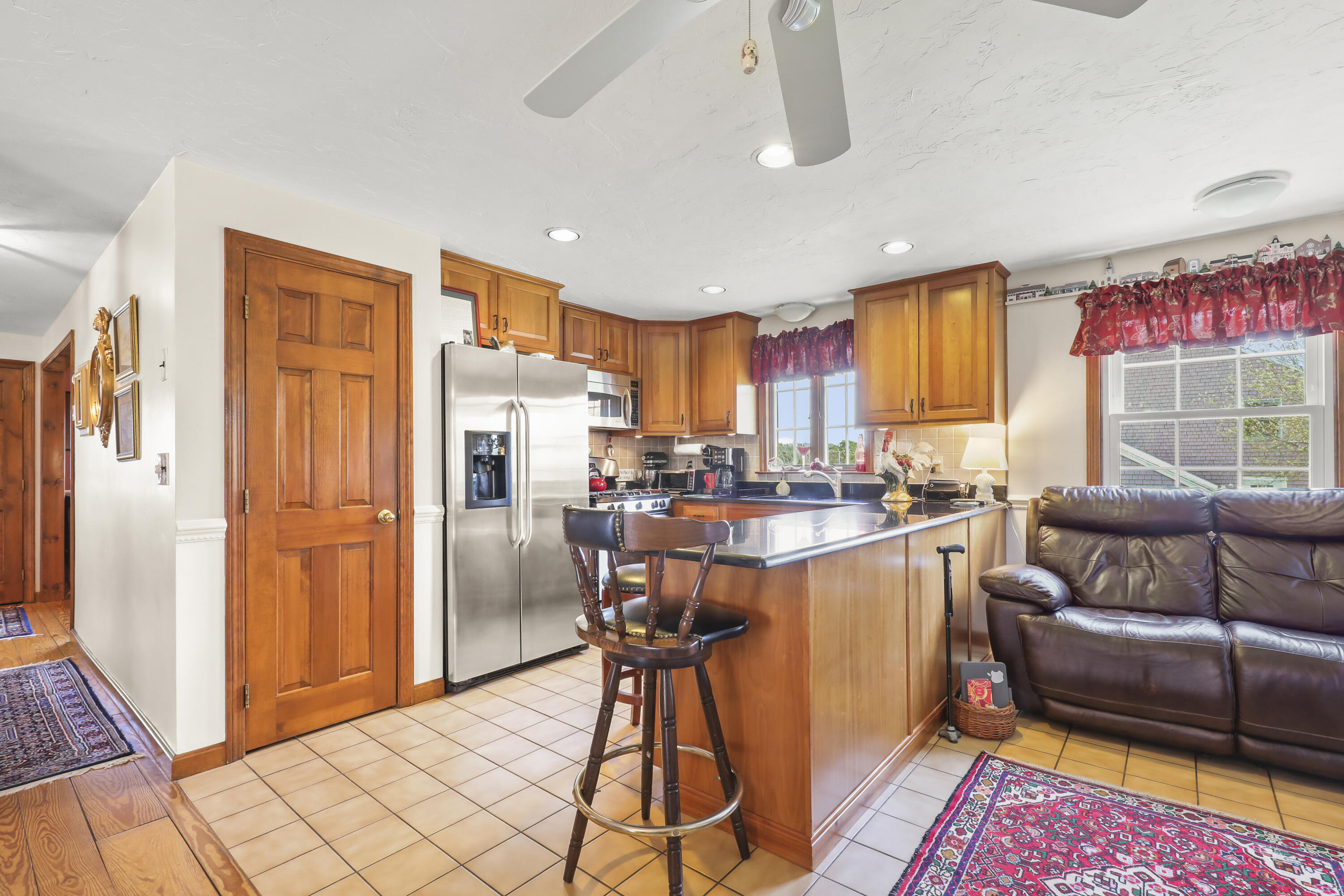 36 Town Neck Road Sandwich, MA 02563 - Photo 24 of 67 a kitchen with stainless steel appliances granite countertop a refrigerator and a stove top oven