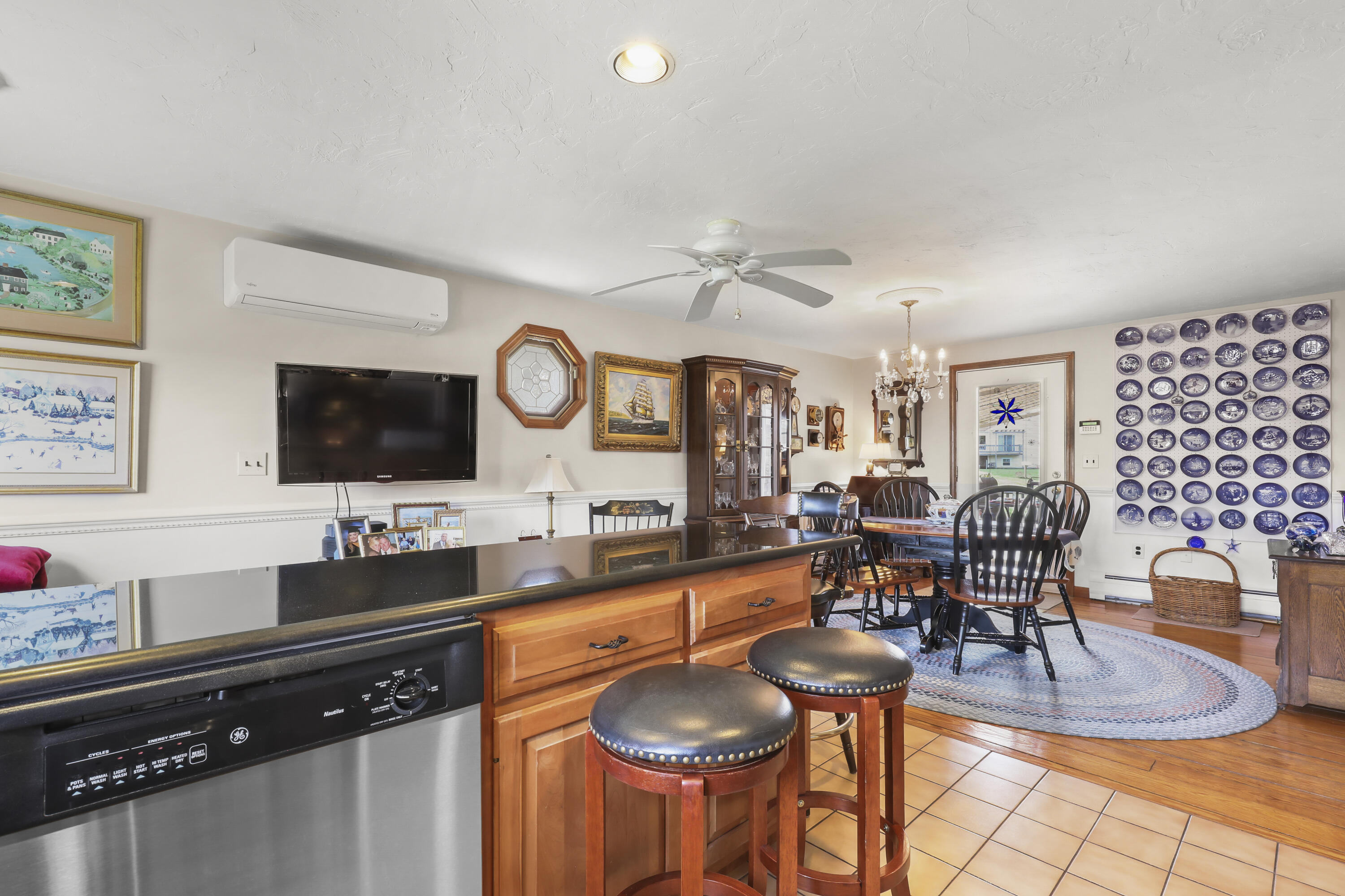 36 Town Neck Road Sandwich, MA 02563 - Photo 28 of 67 a kitchen with granite countertop a stove a sink and a dining table with chairs