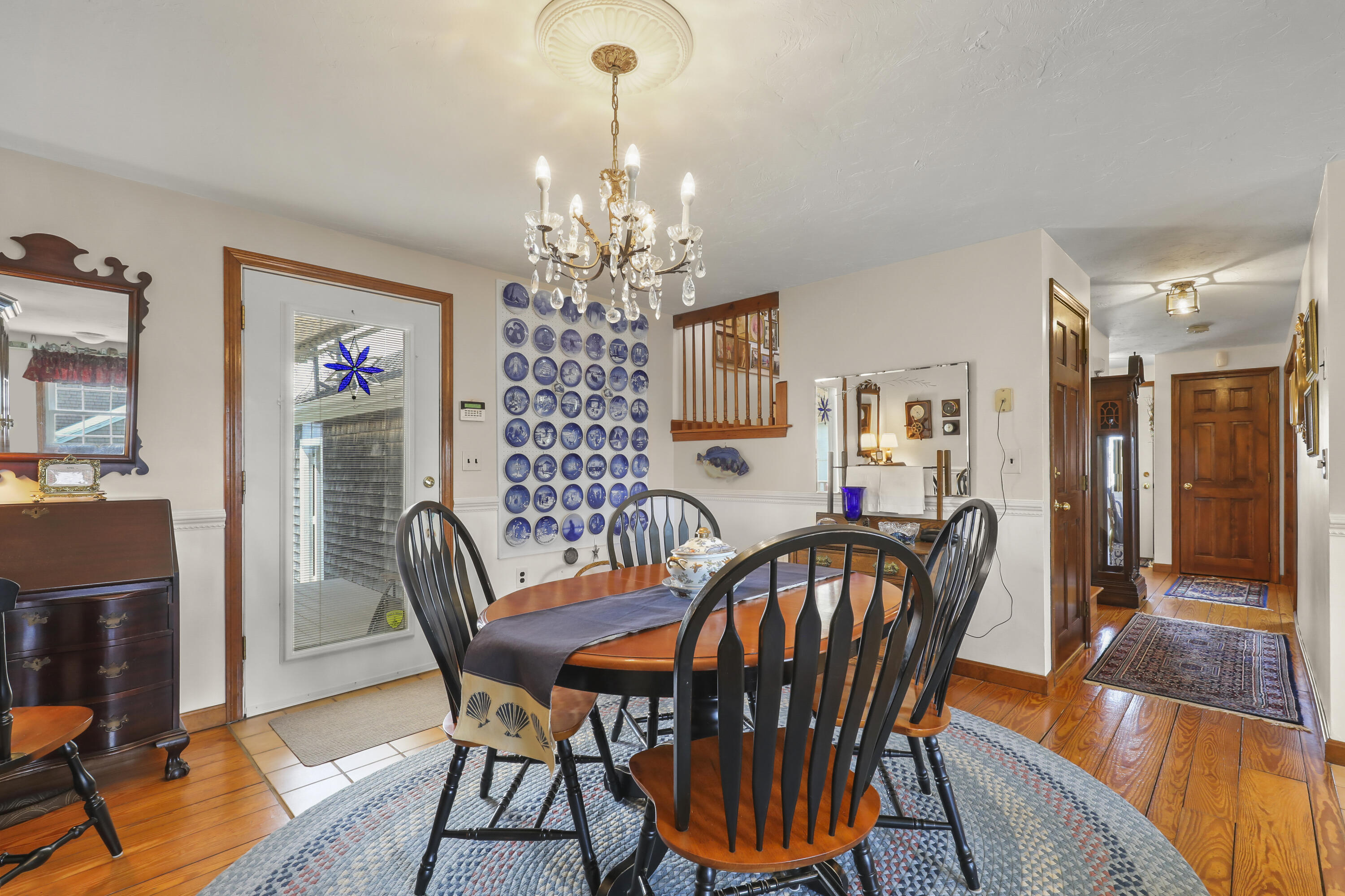 36 Town Neck Road Sandwich, MA 02563 - Photo 32 of 67 a view of a dining room with furniture wooden floor and a chandelier