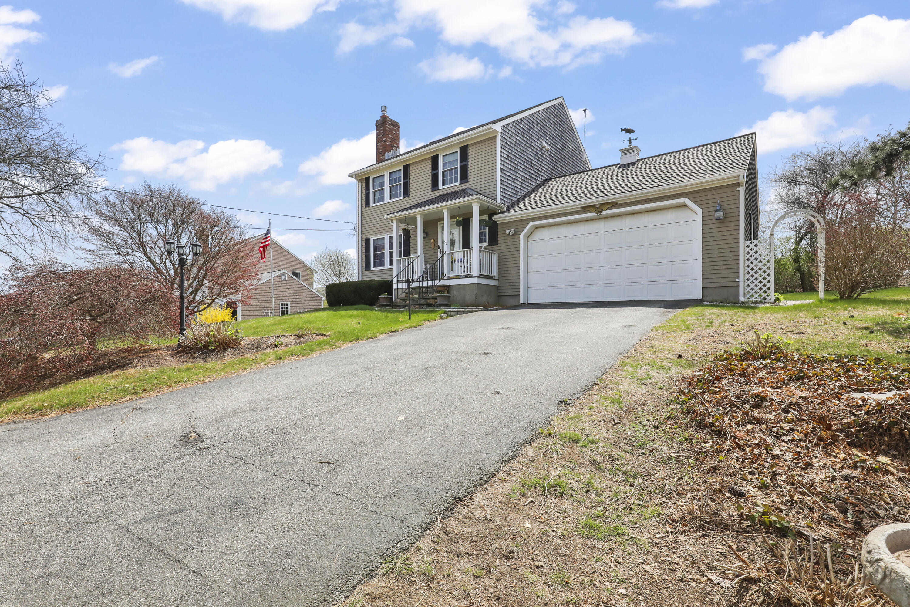 36 Town Neck Road Sandwich, MA 02563 - Photo 4 of 67 a front view of house with yard and trees in the background