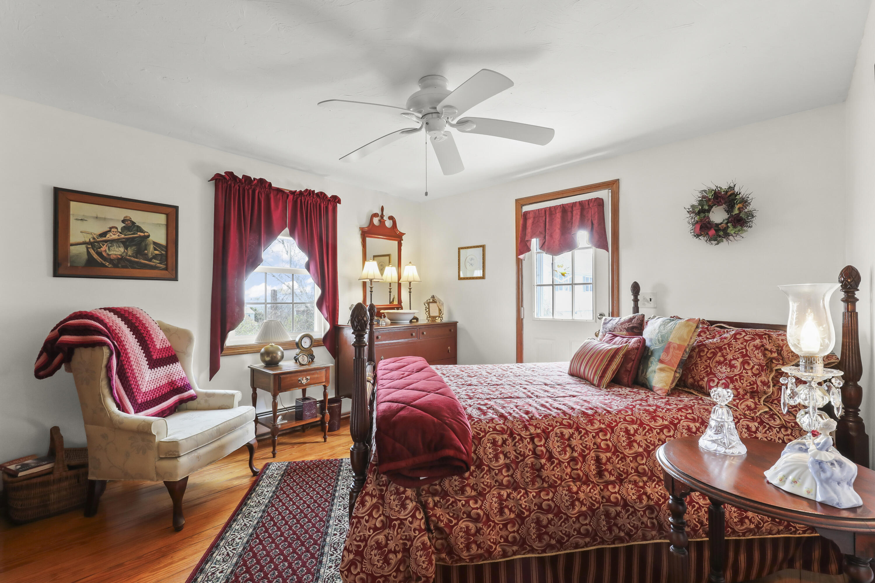 36 Town Neck Road Sandwich, MA 02563 - Photo 42 of 67 a bedroom with a bed and wooden floor