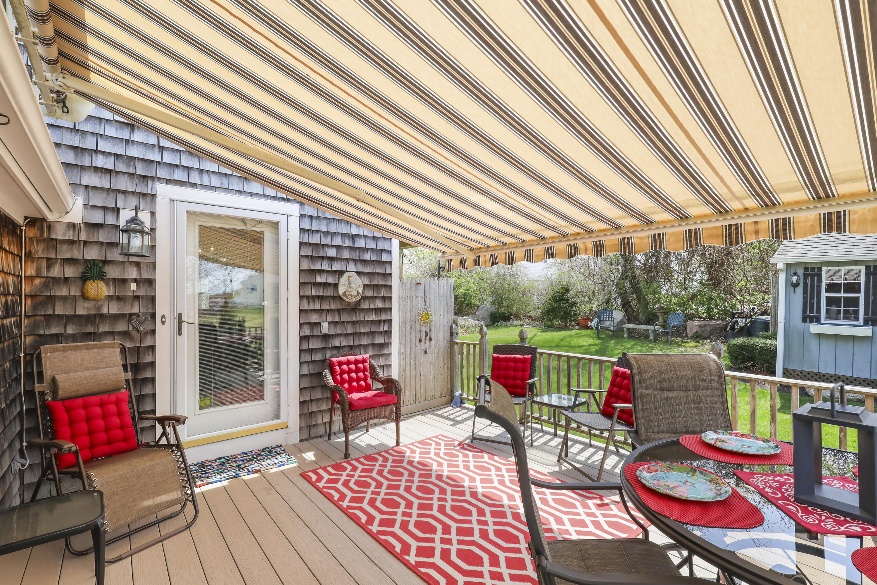 36 Town Neck Road Sandwich, MA 02563 - Photo 8 of 67 a view of deck with table and chairs and wooden floor