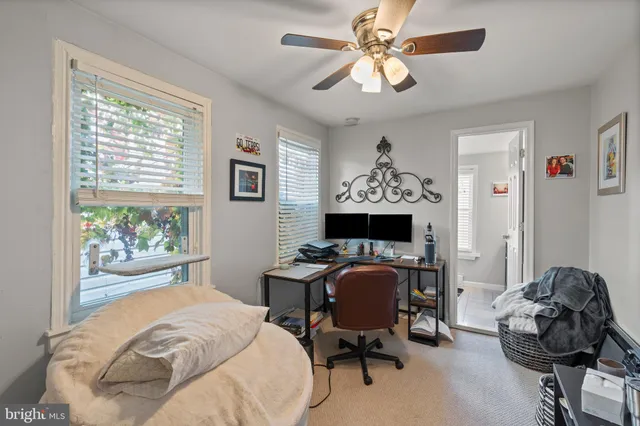 a bedroom that has a bed and a chair in it