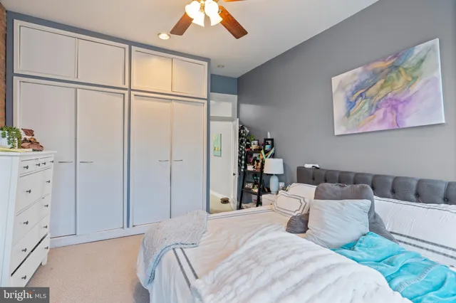 a bed room with a bed and a window