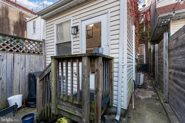 a view of a house with brick walls