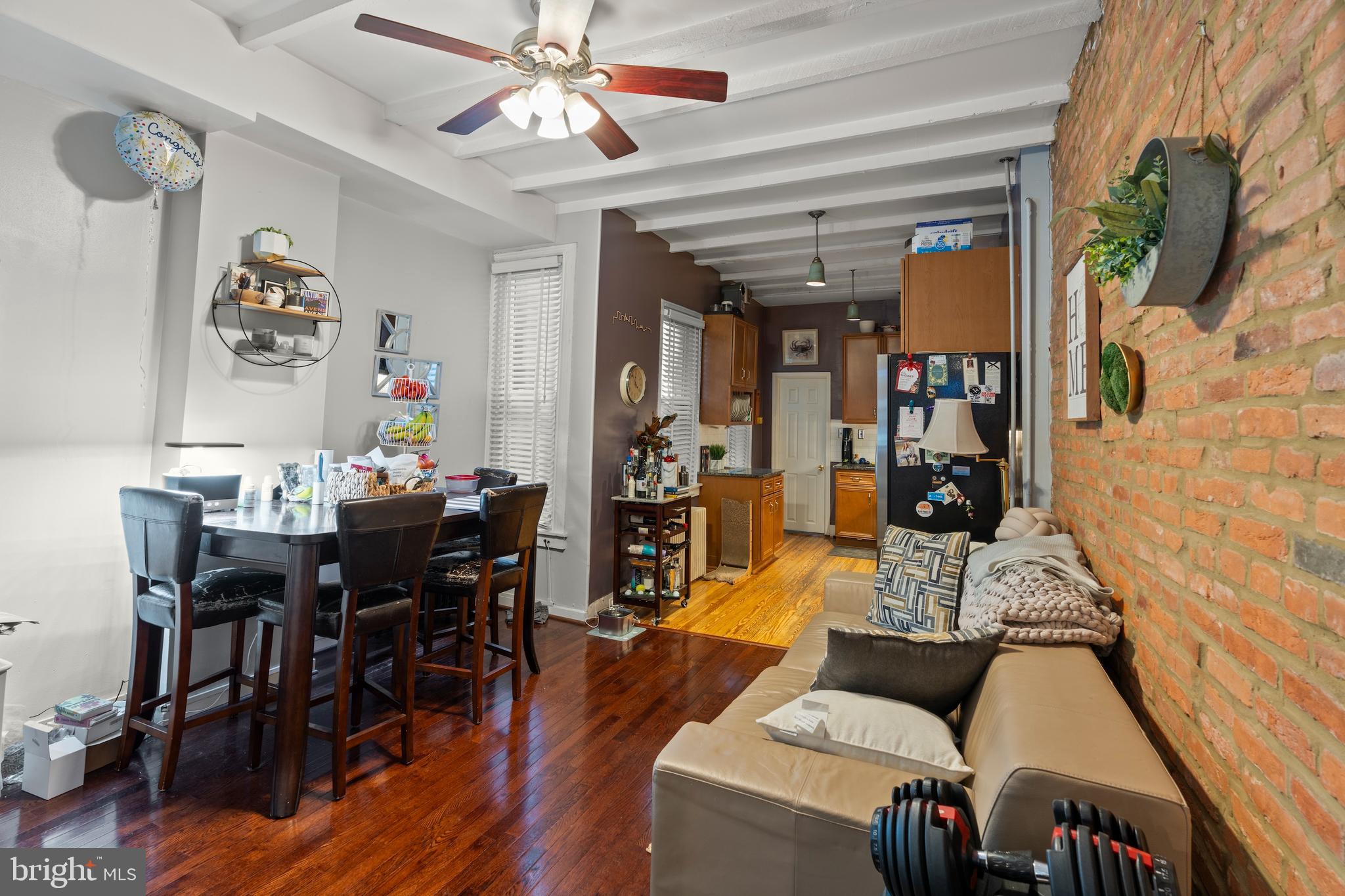 1043 Riverside Avenue Baltimore, MD 21230 - Photo 5 of 41 a view of a dining room with furniture and wooden floor