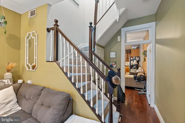 a view of an entryway with wooden floor