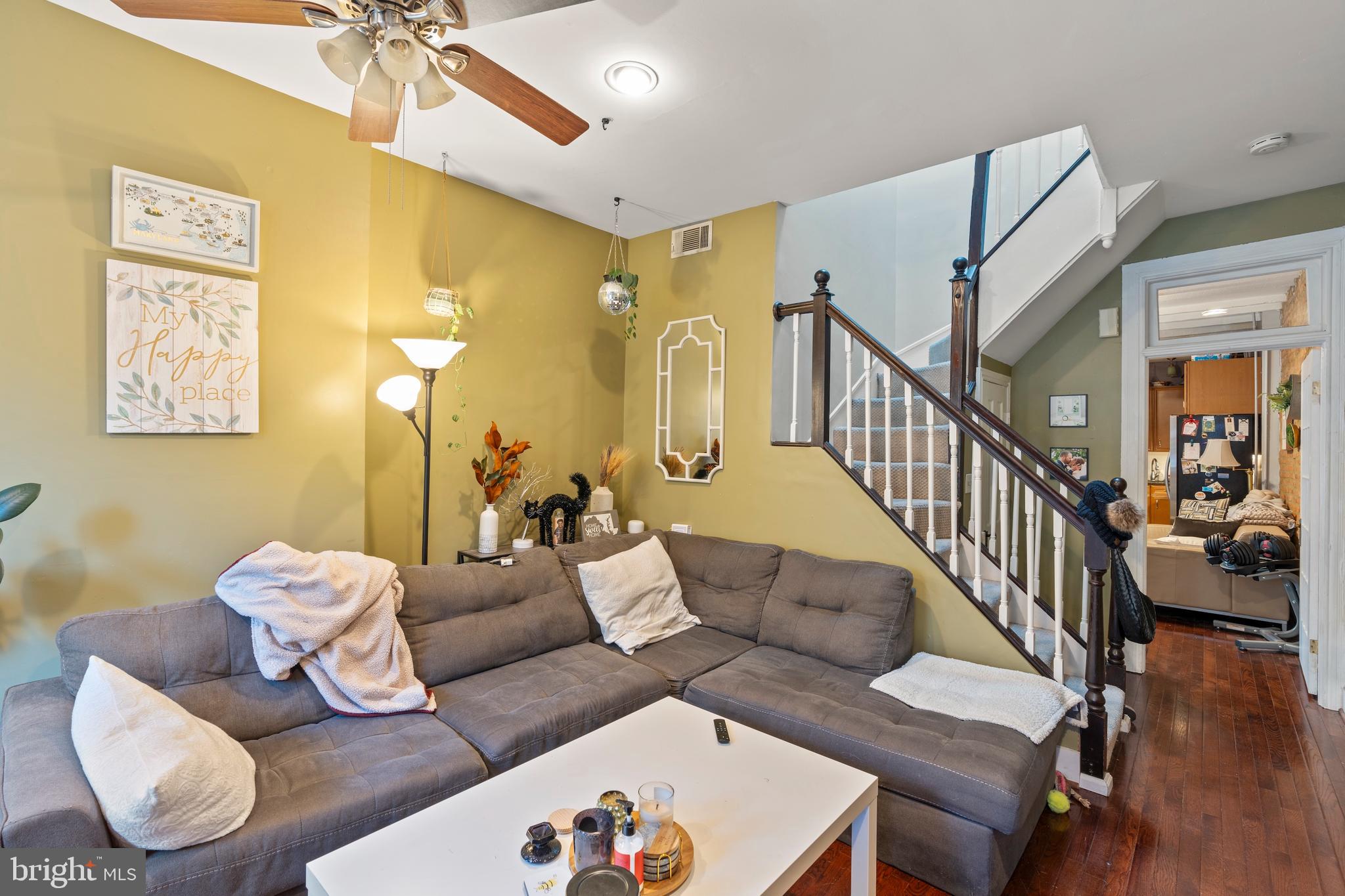 1043 Riverside Avenue Baltimore, MD 21230 - Photo 7 of 41 a living room with furniture and wooden floor